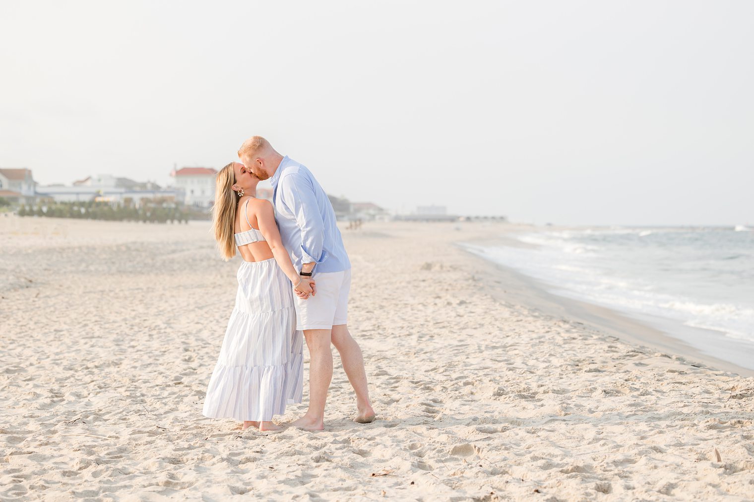 couple sharing a kiss in their engagement session at Asbury Park Dog