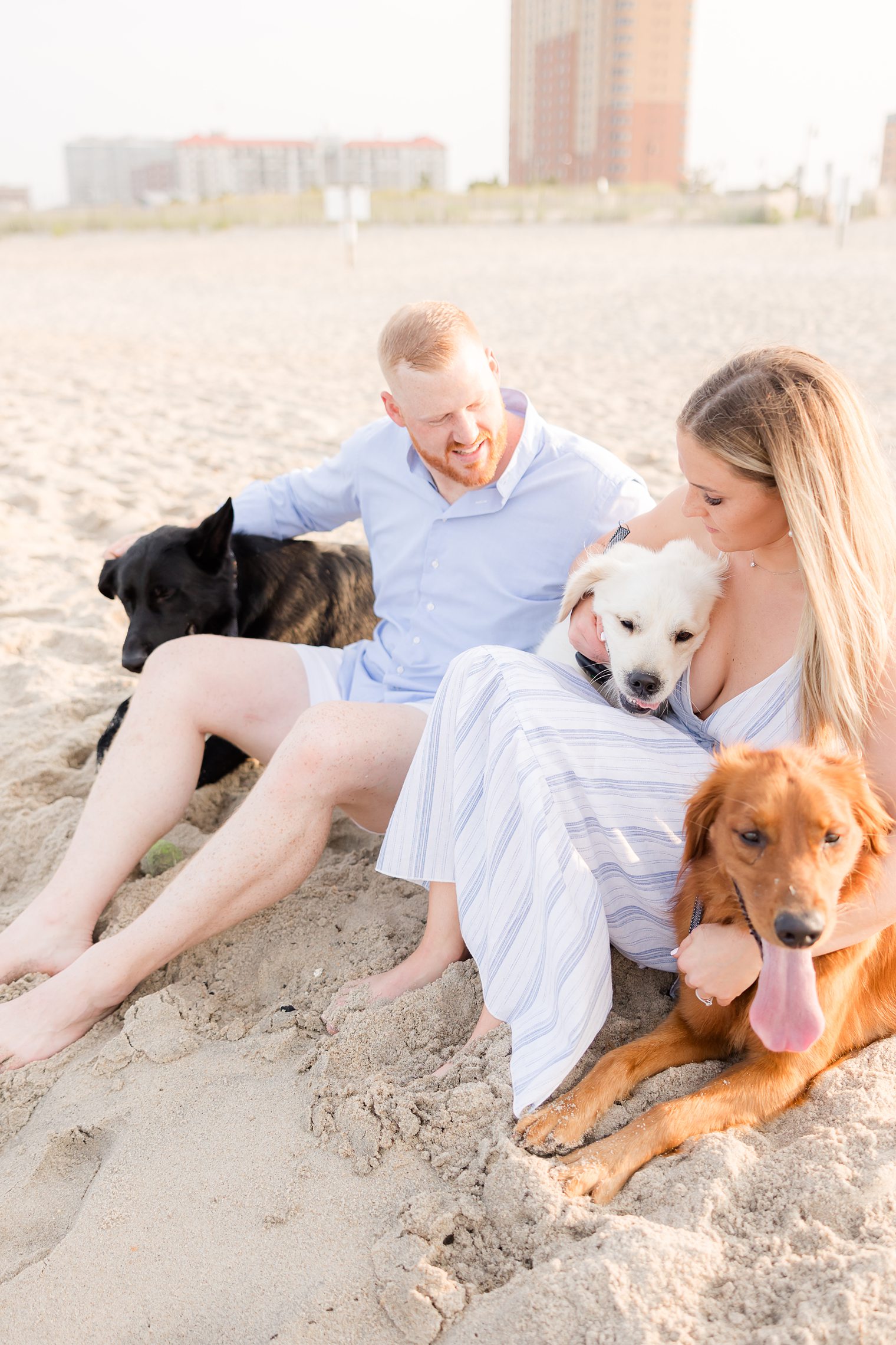 Future husband and wife hugging their fur babies