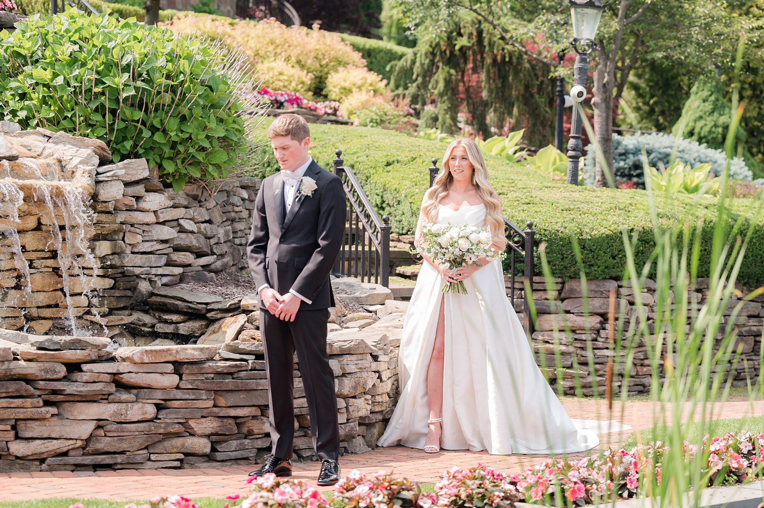 groom waiting for his future wife to share their first look