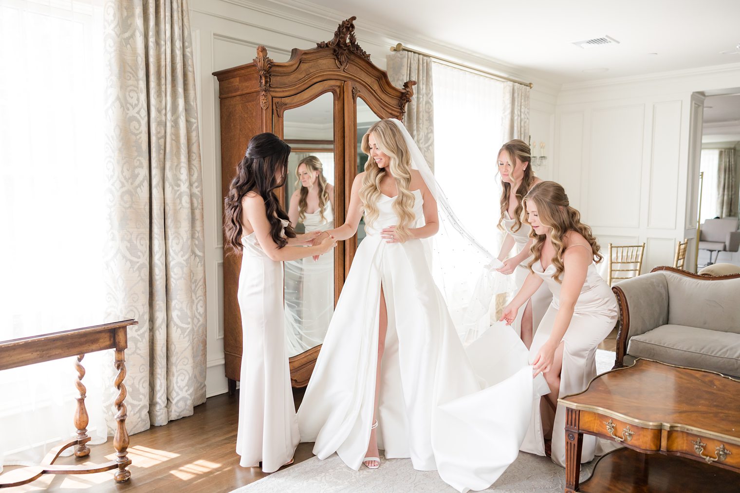 bridesmaids helping bride to get ready at Park Savoy Estate