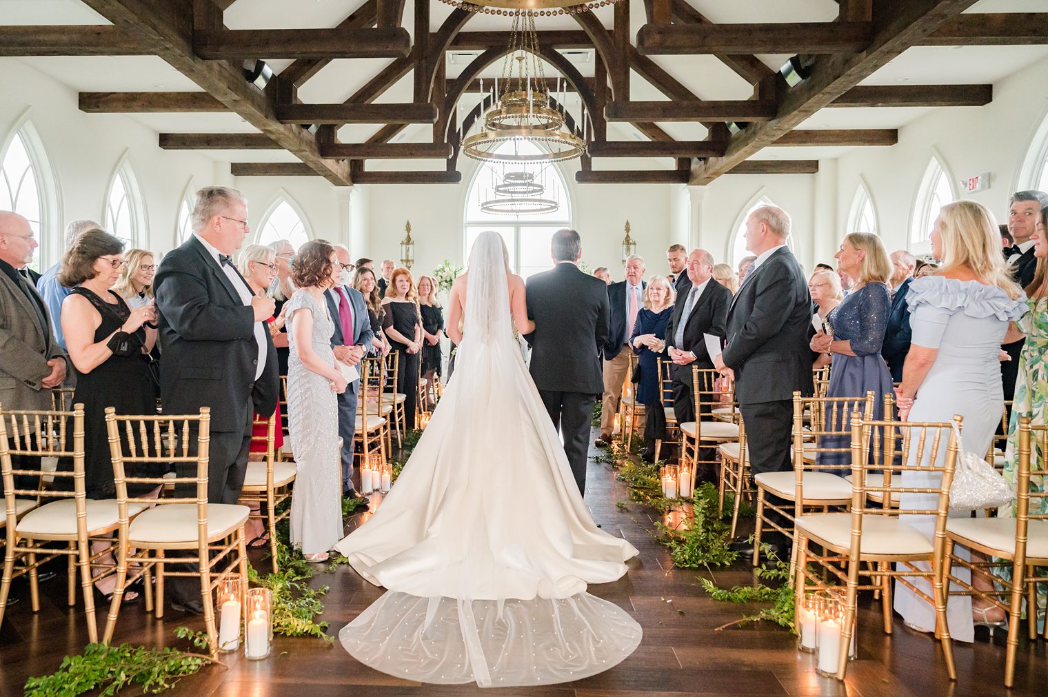 Bride with her father walking into the aisle 