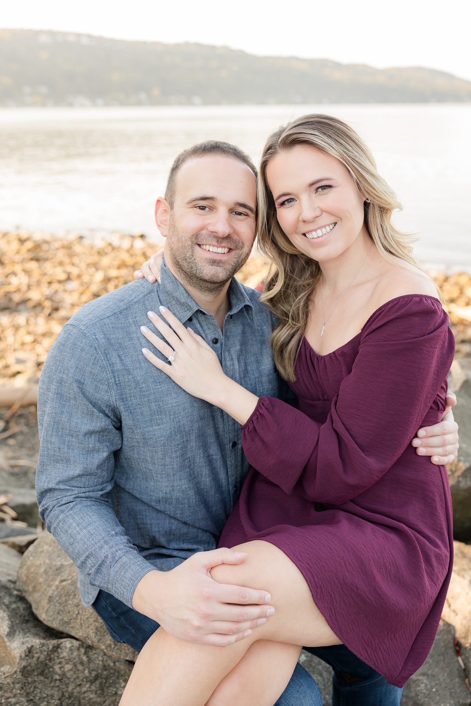 beautiful couple posing at their engagement session at Tallman Mountain State