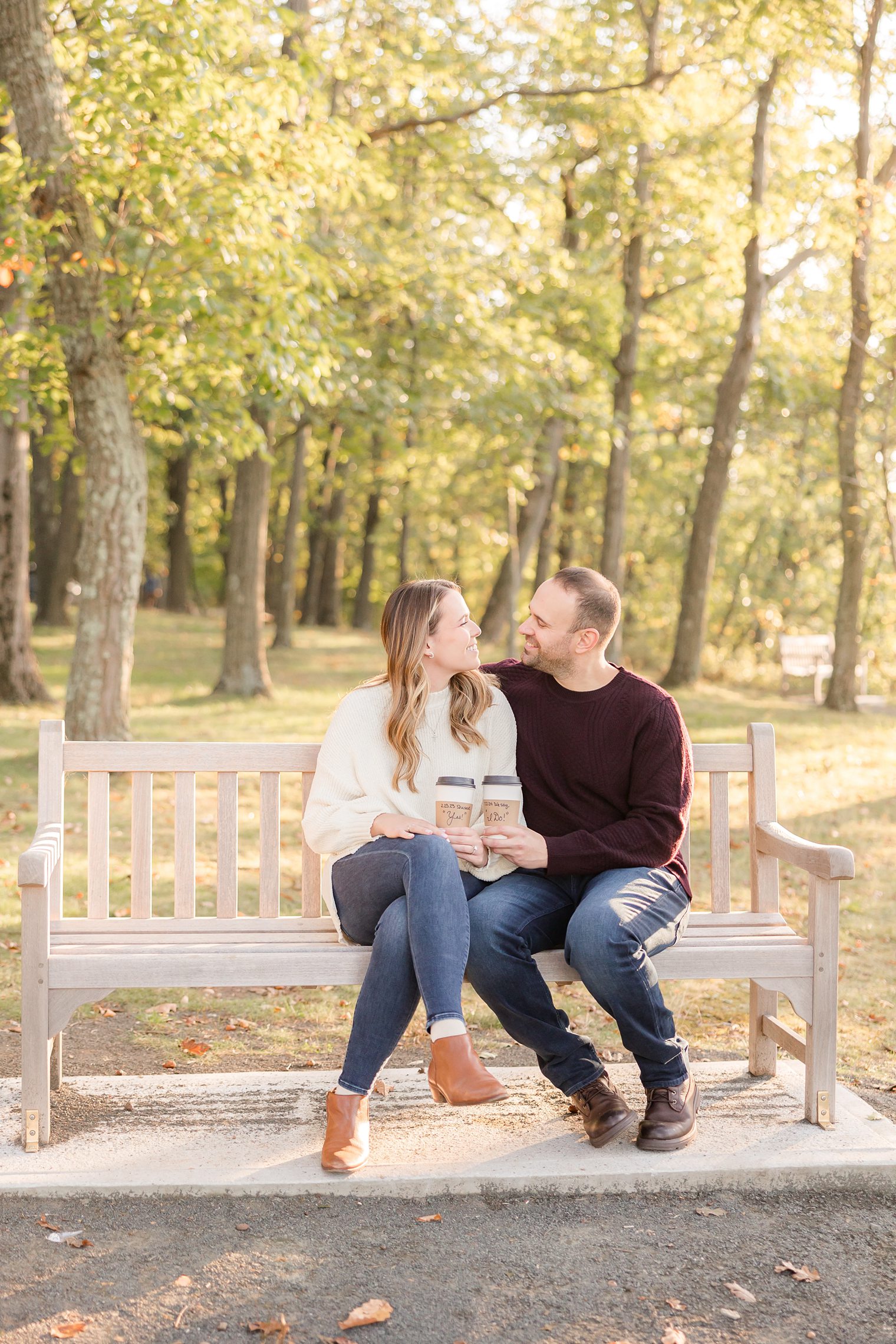 beautiful couple enjoying, sitting in a bench