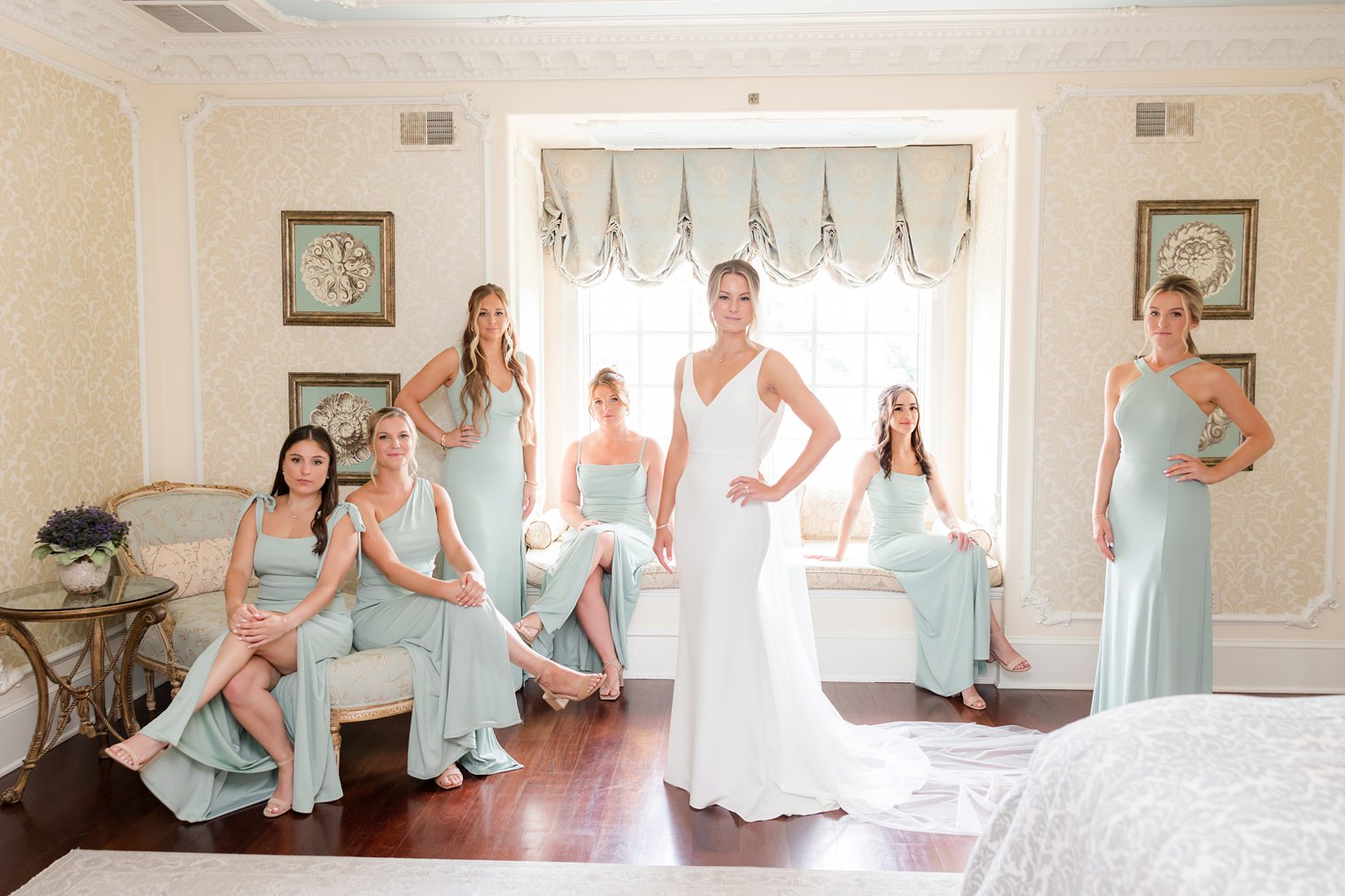 Bride posing with her bridesmaids 