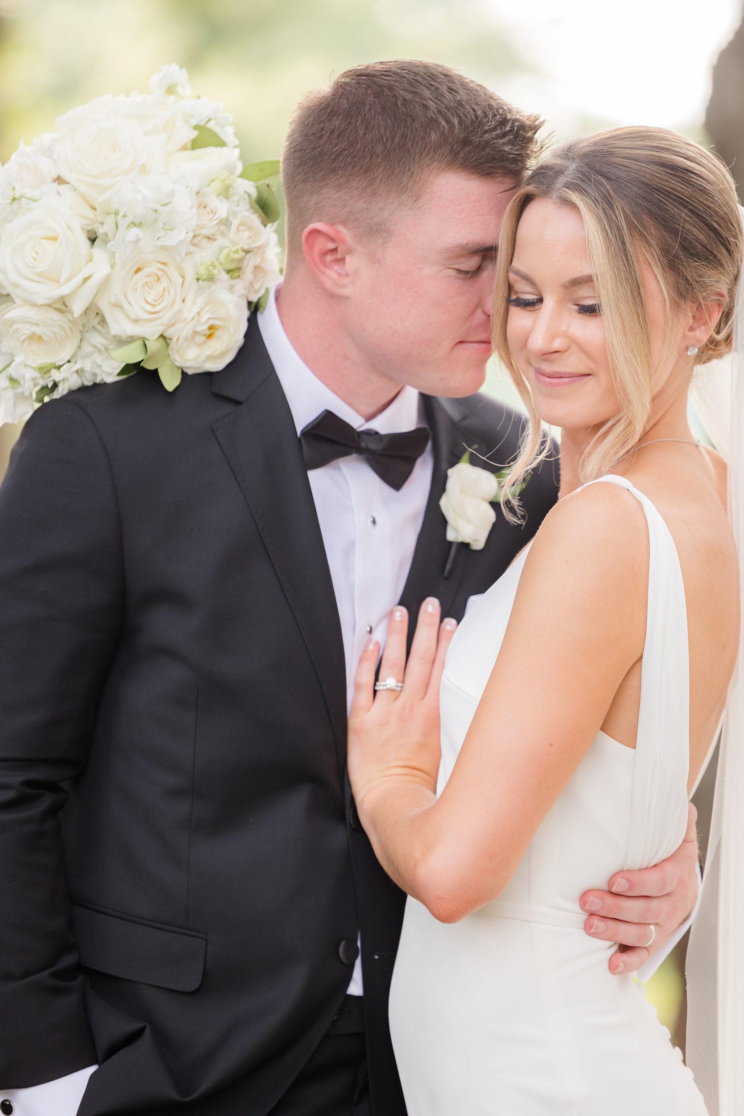 groom and bride posing romantically