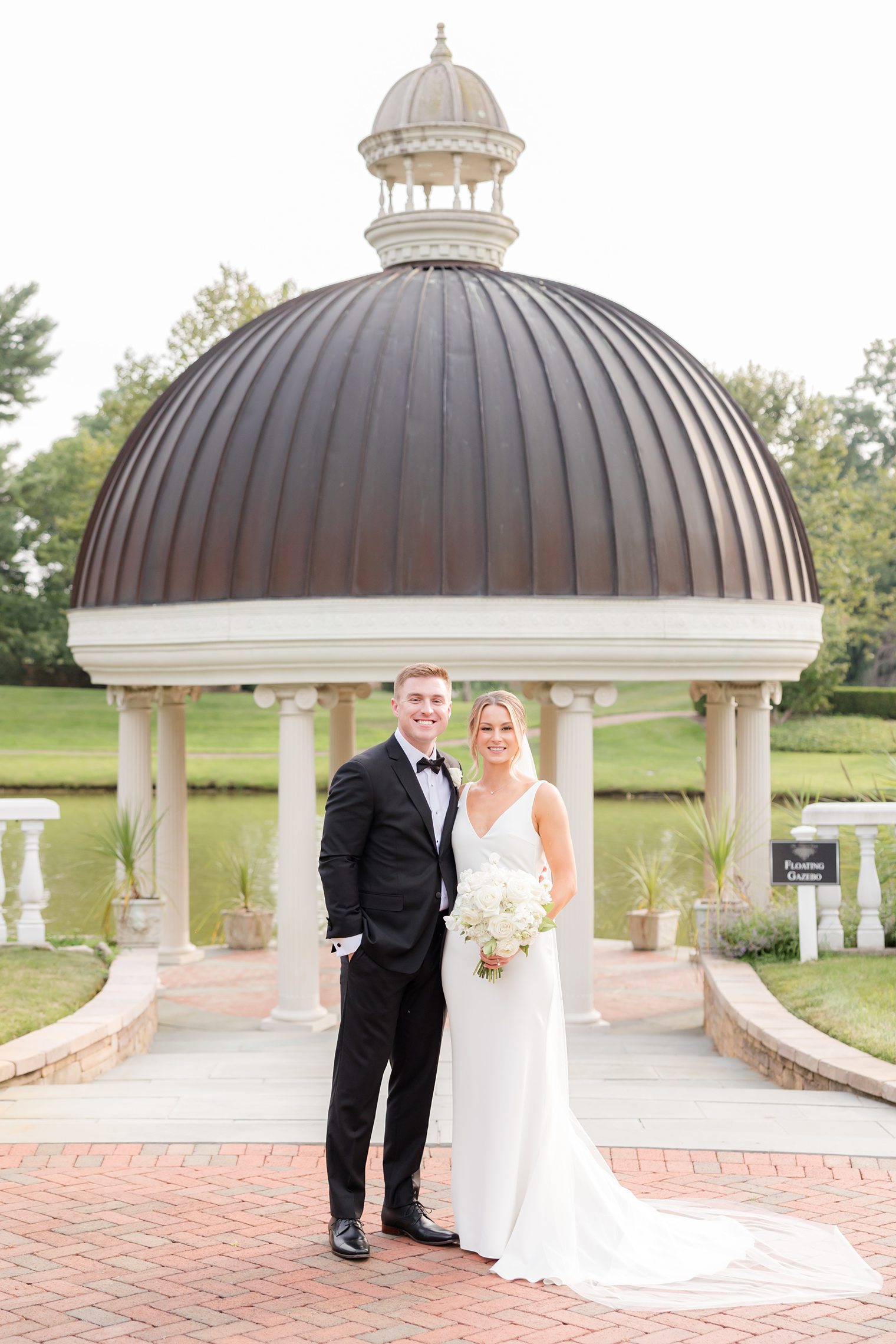 Husband and wife posing at Asford Estate