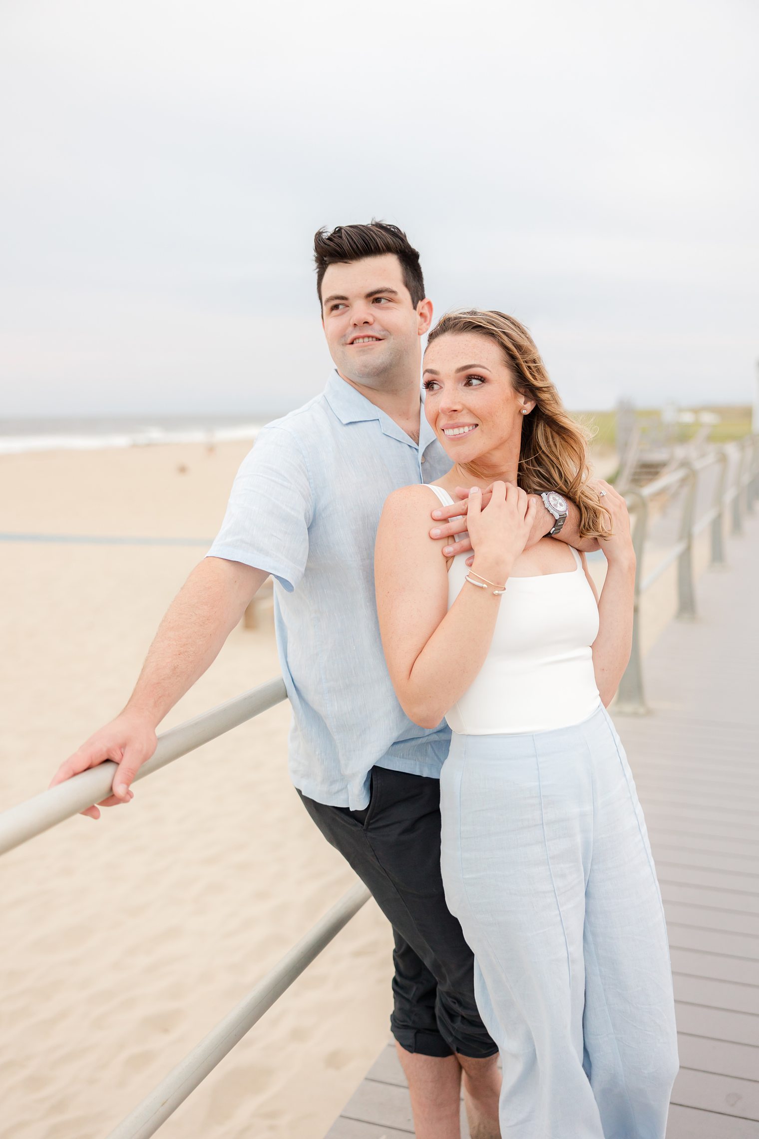 future husband and wife posing looking the horizon 