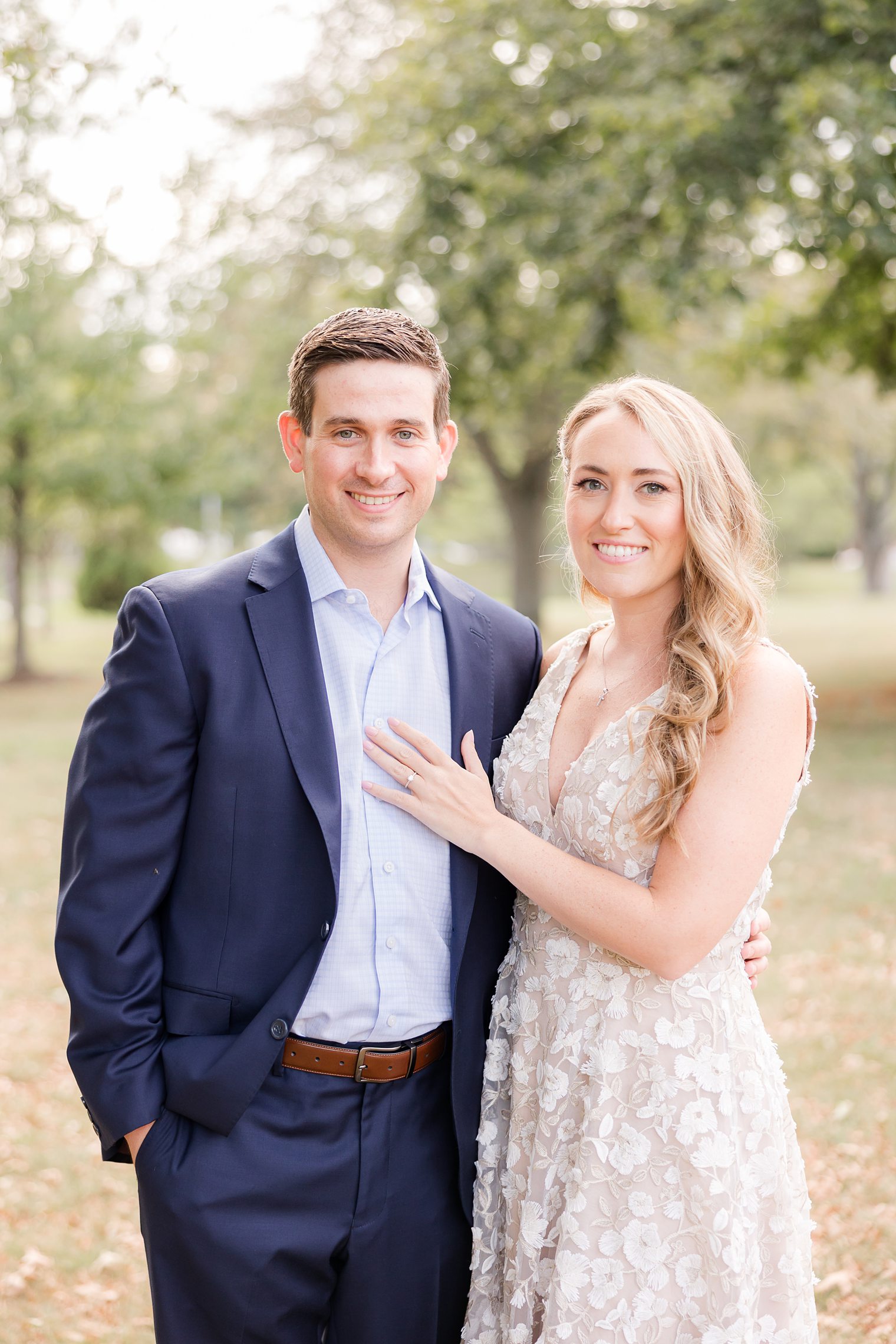 happy couple posing for their engagement album