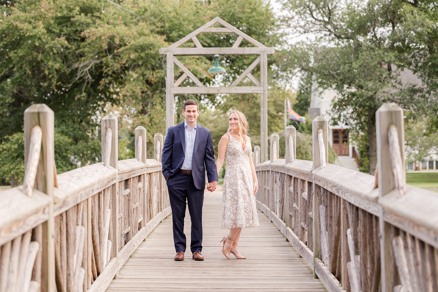 bride looking at her fiancé while holding hands