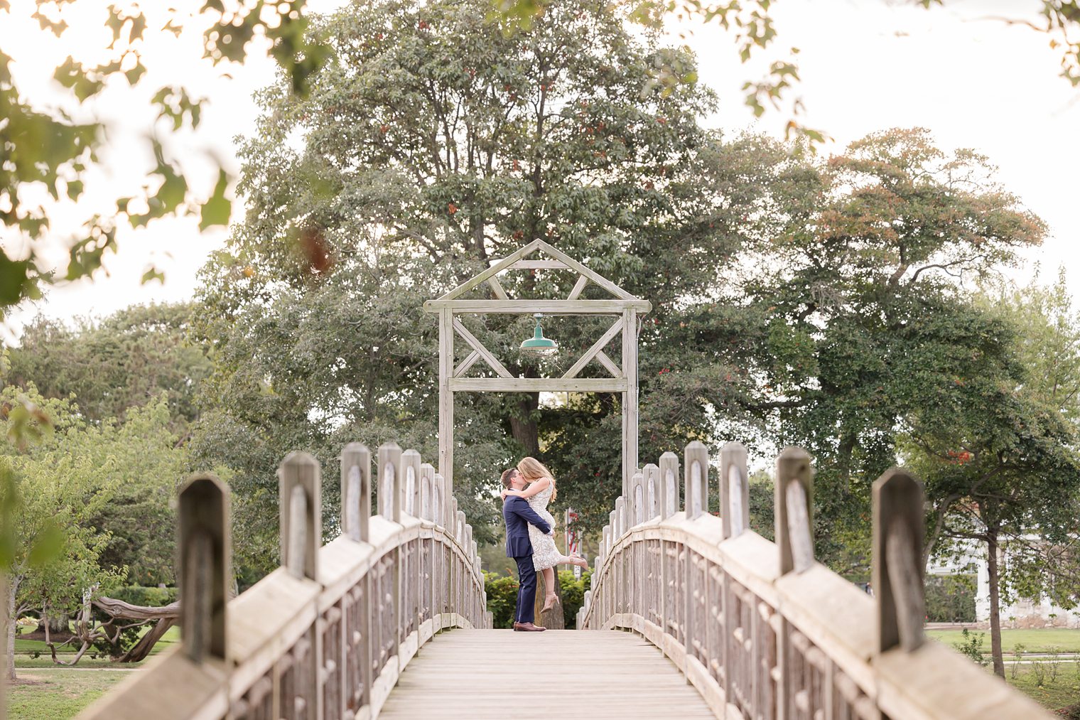 Future husband and wife kissing each other at the bridge 