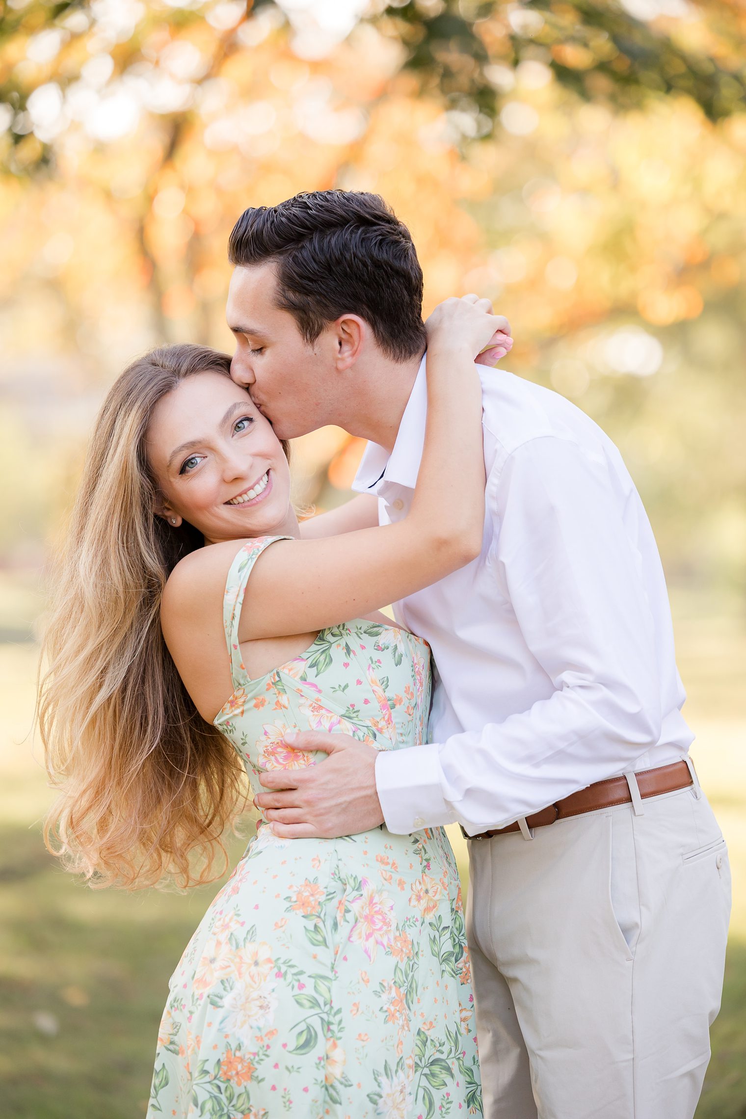 Fiancé kiss his bride in the cheek