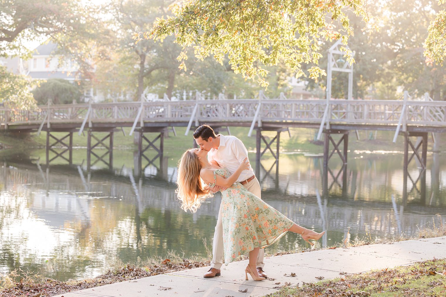 future husband leaning his bride to kiss her