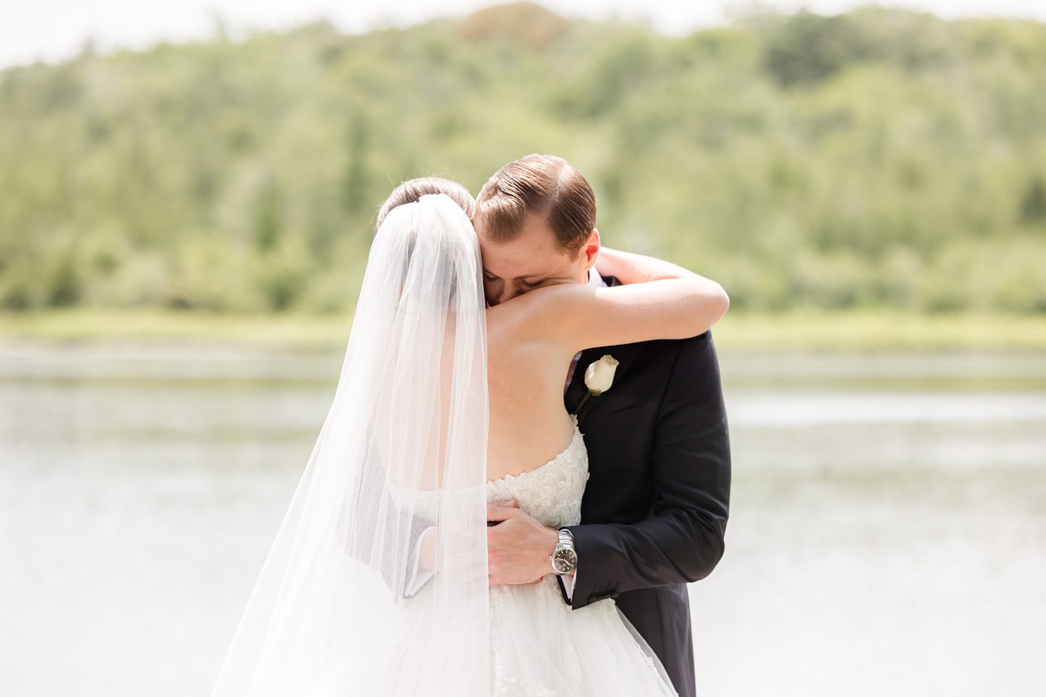 groom and bride hugging after sharing first look