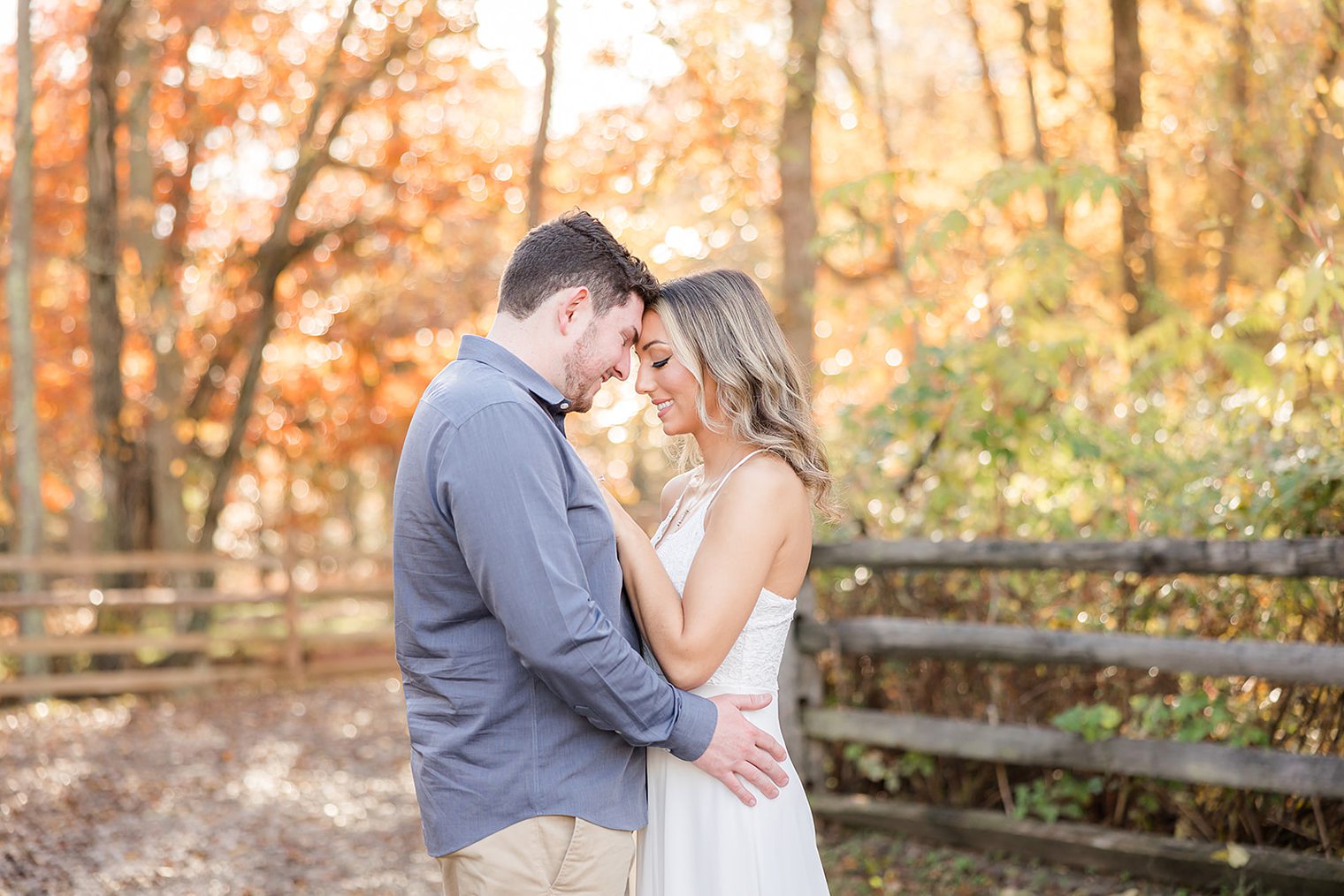 future husband and wife putting their foreheads together