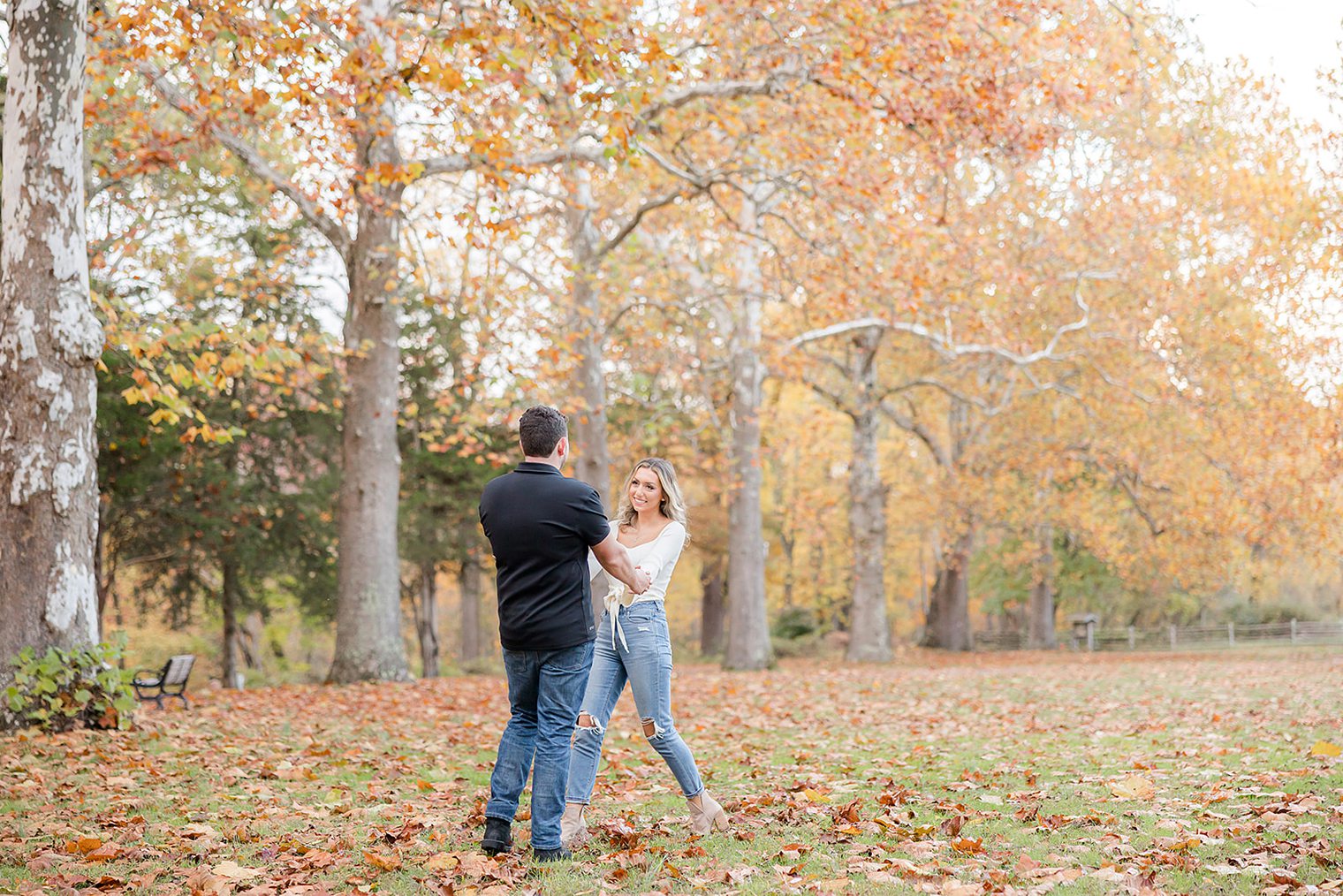 future husband and wife holding hands while they play