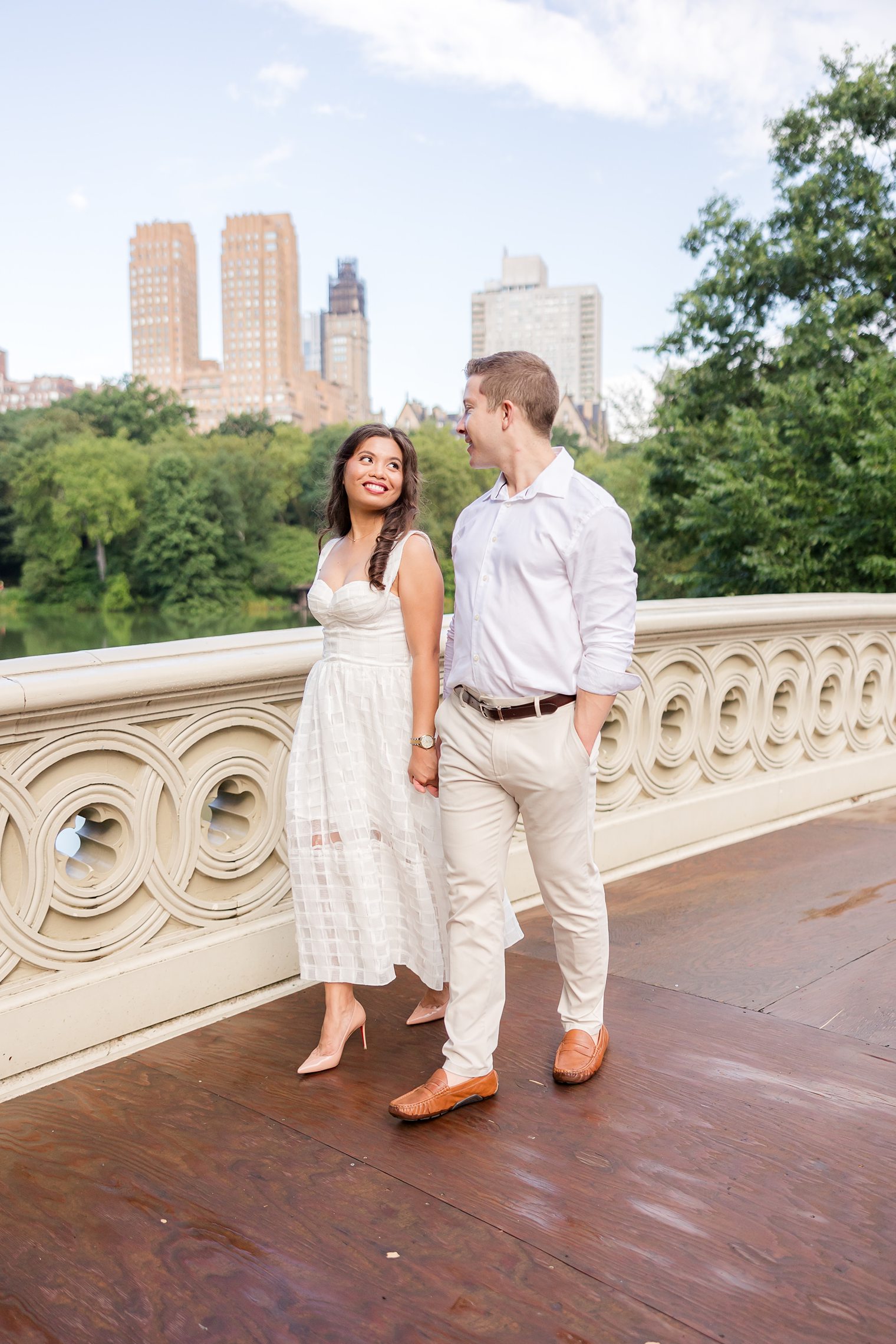 future husband and wife taking hands while they walk