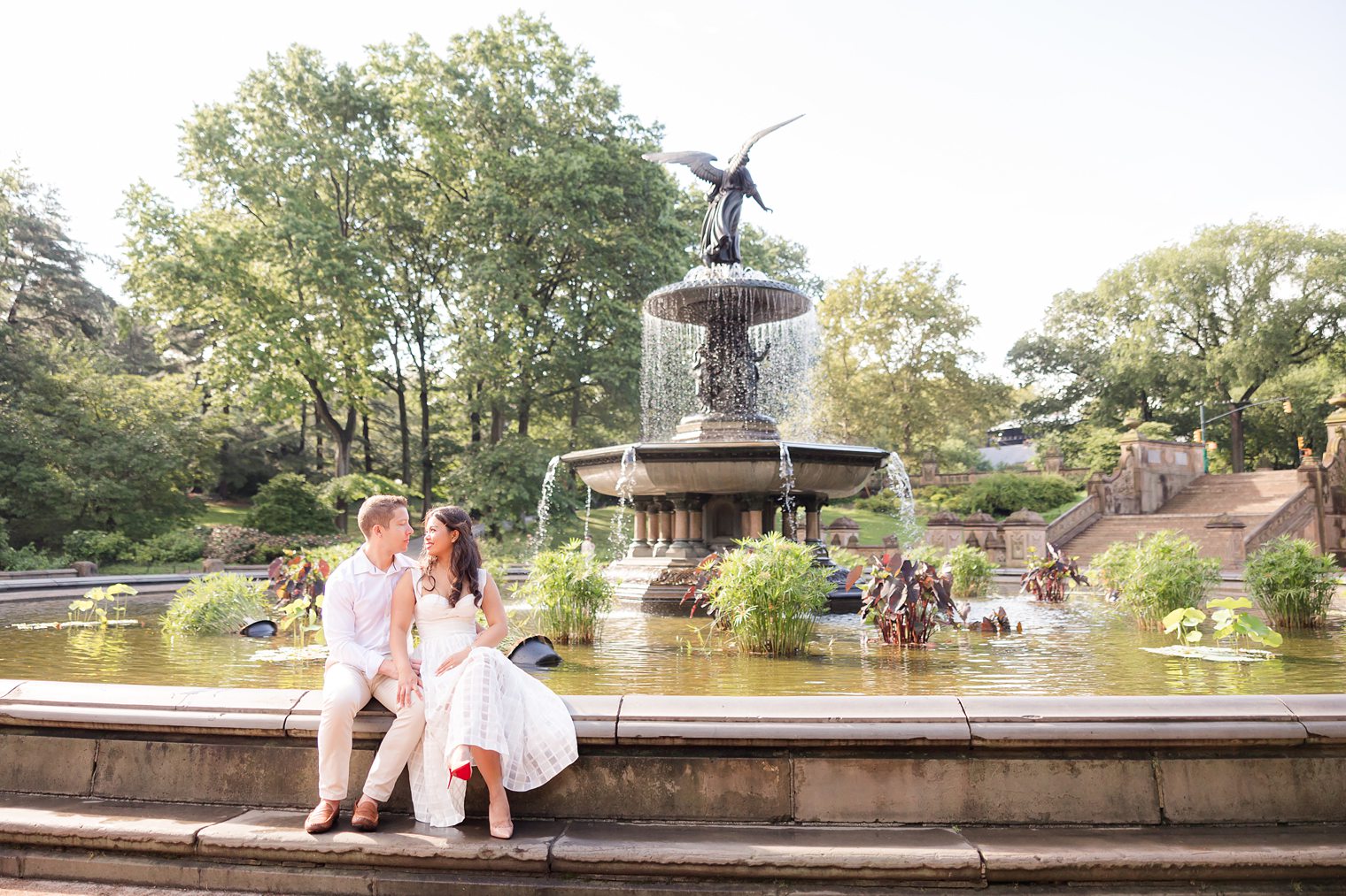 future husband and wife looking each other romantically at Central Park Engagement Session