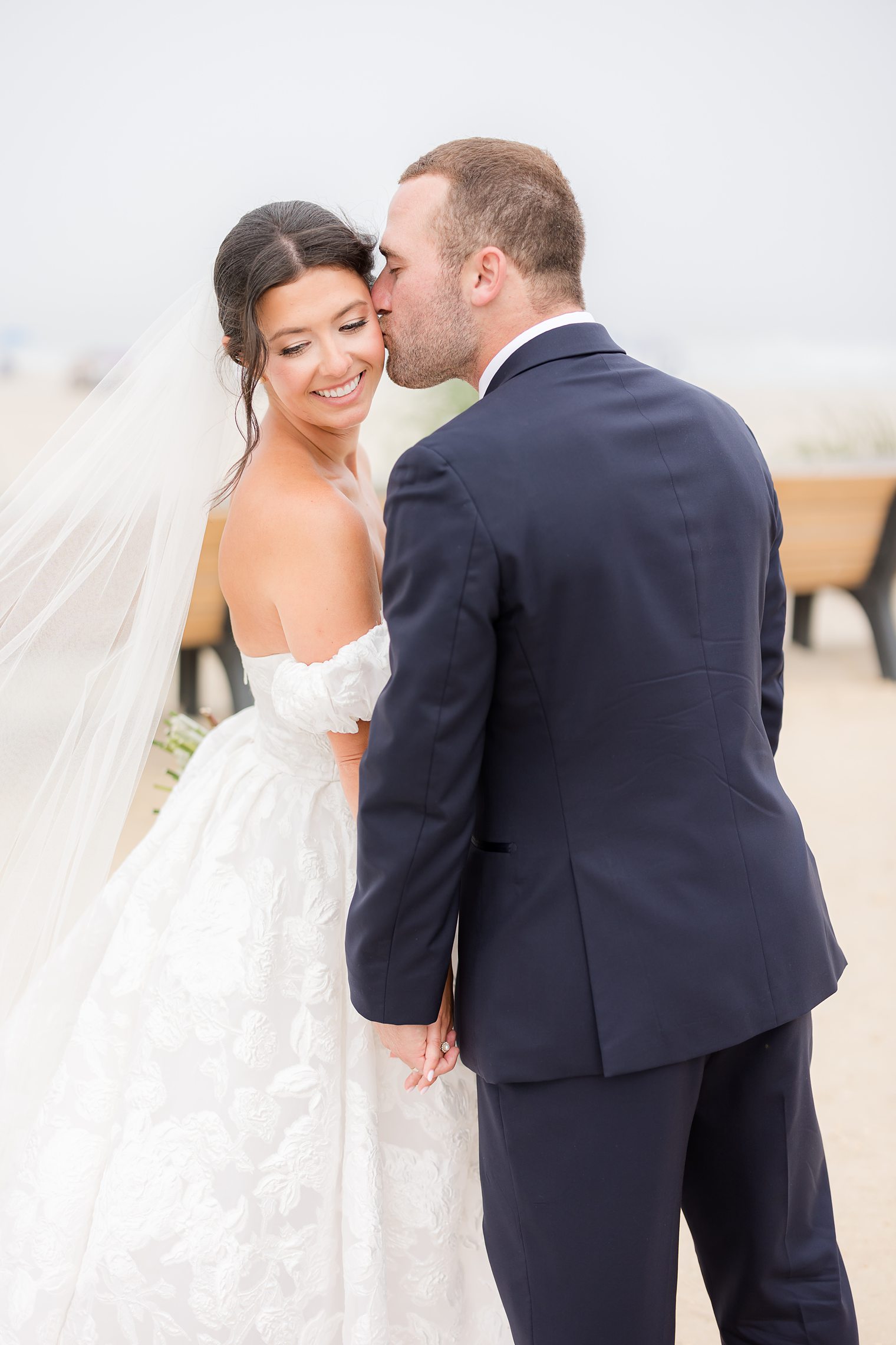 Husband kissing in the cheek to his wife 