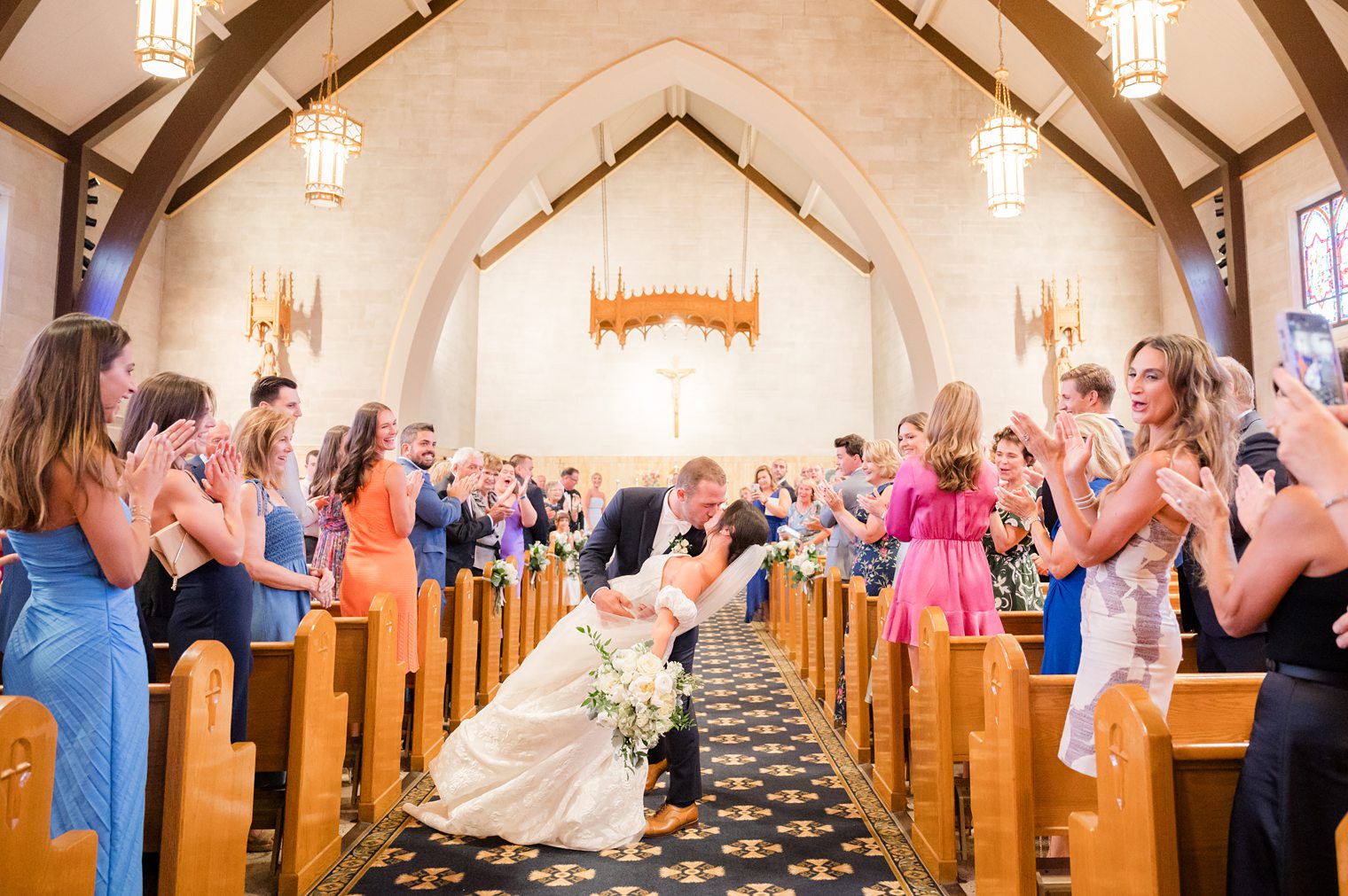 Husband kissing his wife before heading out of the church 