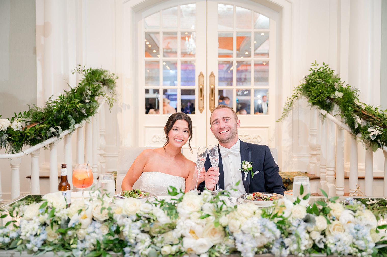 husband and wife at their sweet heart table 