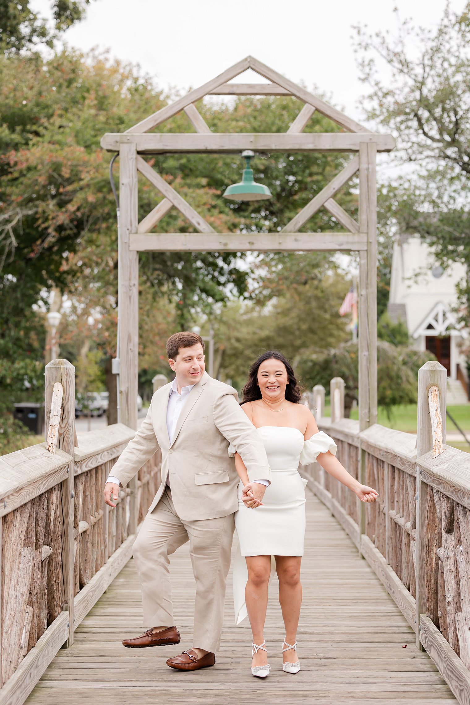 bride and her fiancé having fun during their engagement session