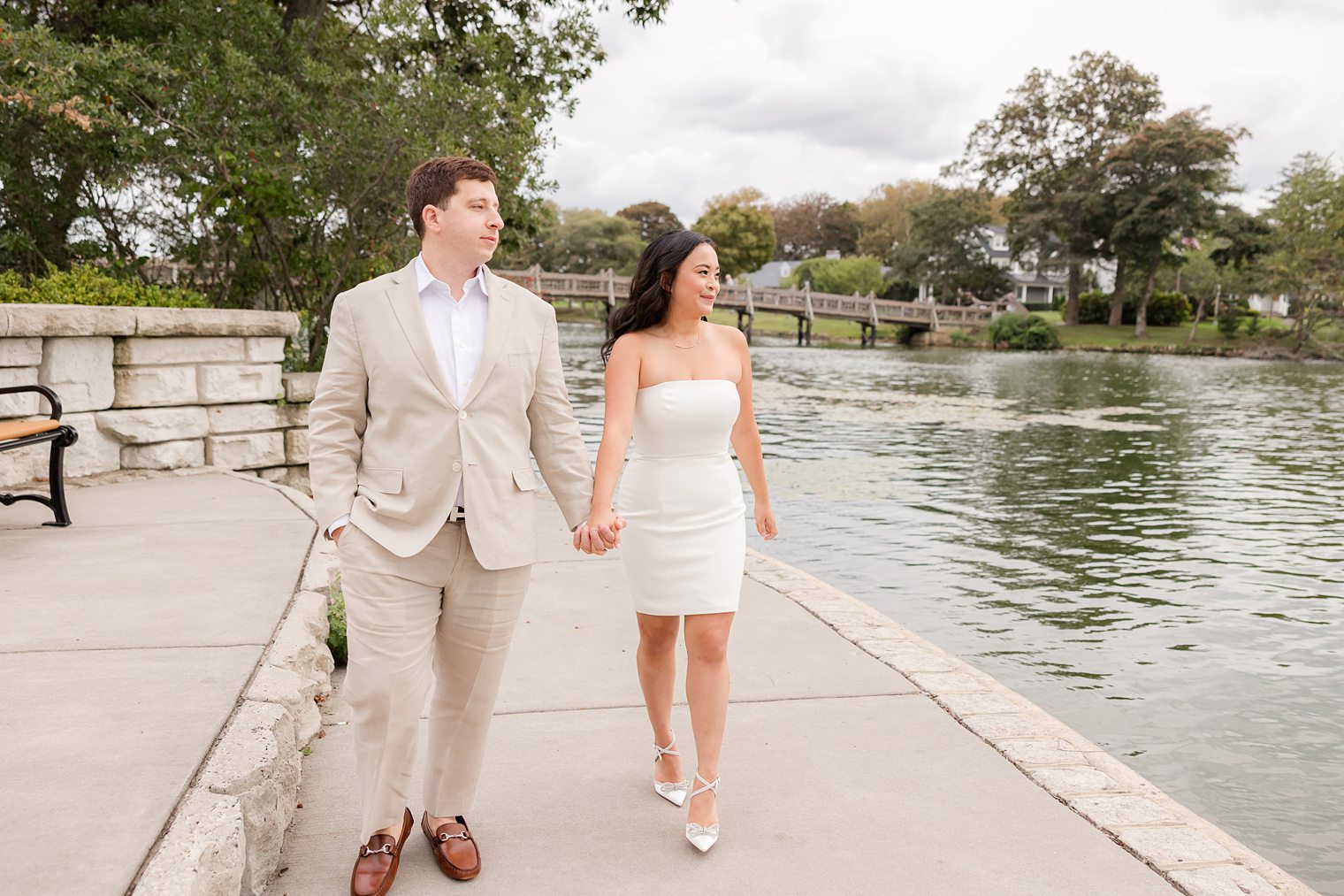 bride and fiancé looking to the sping lake 