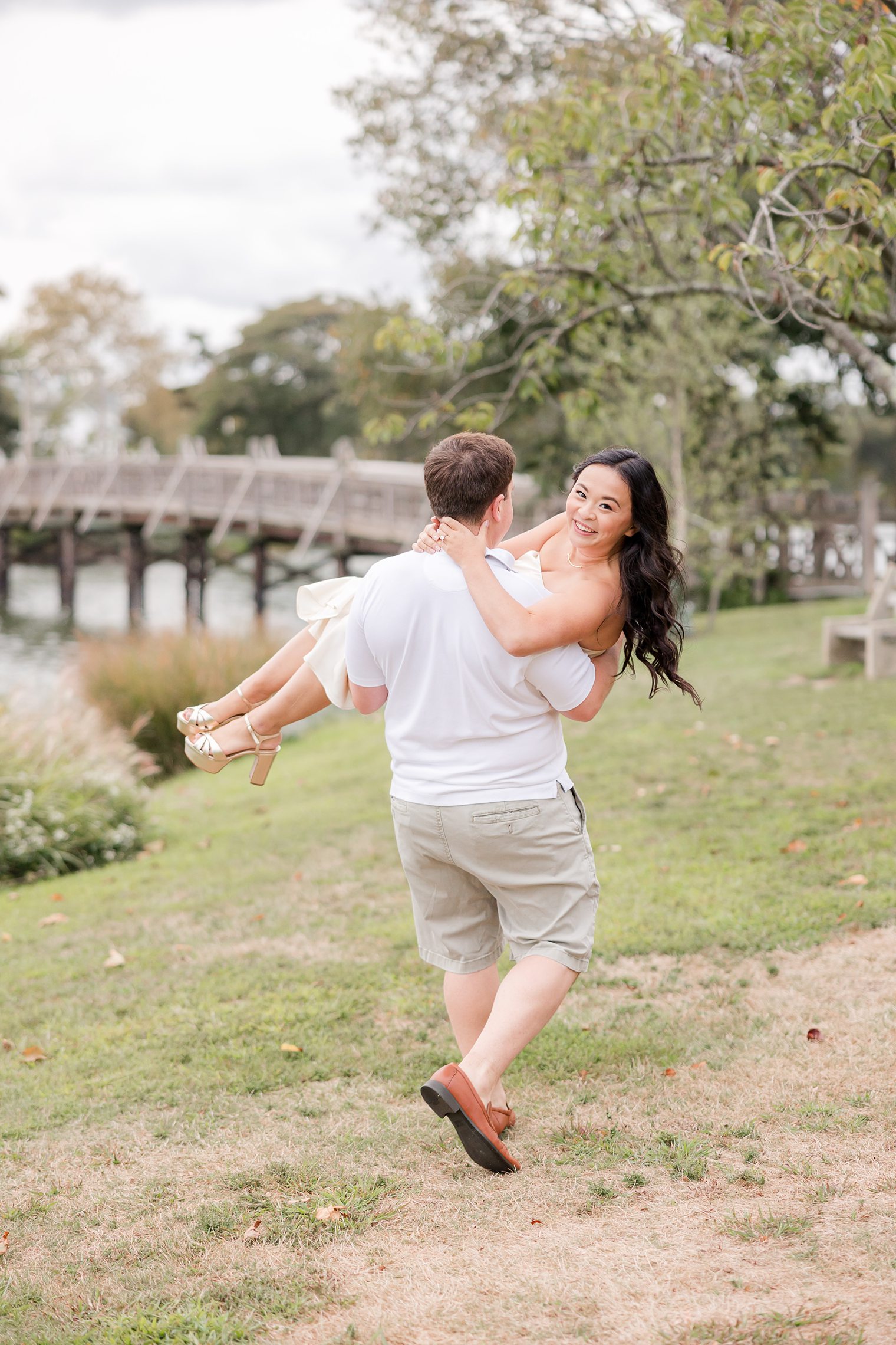 fiancé holding up to his bride 