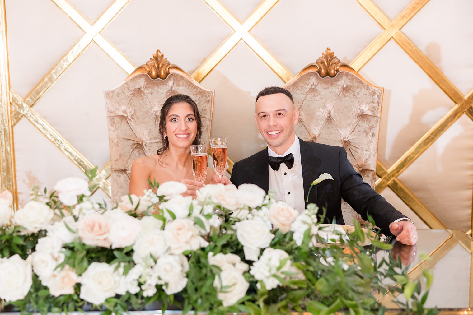 husband and wife at their sweet heart table 