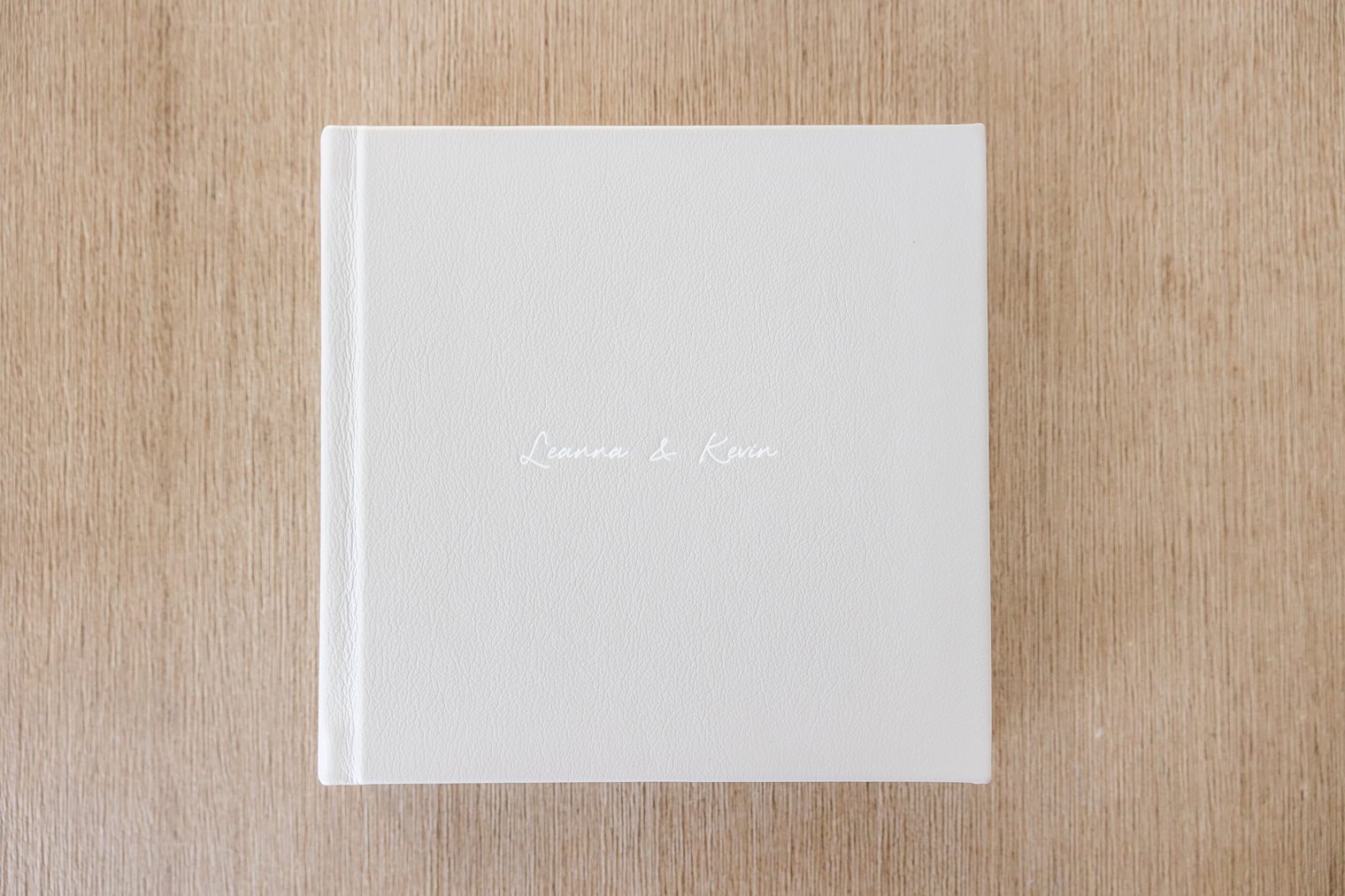engraving of Leanna and Kevin's engagement album