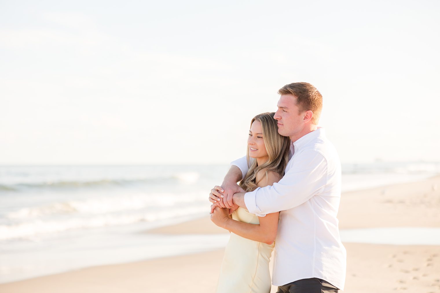 future husband and wife looking to the sunset 