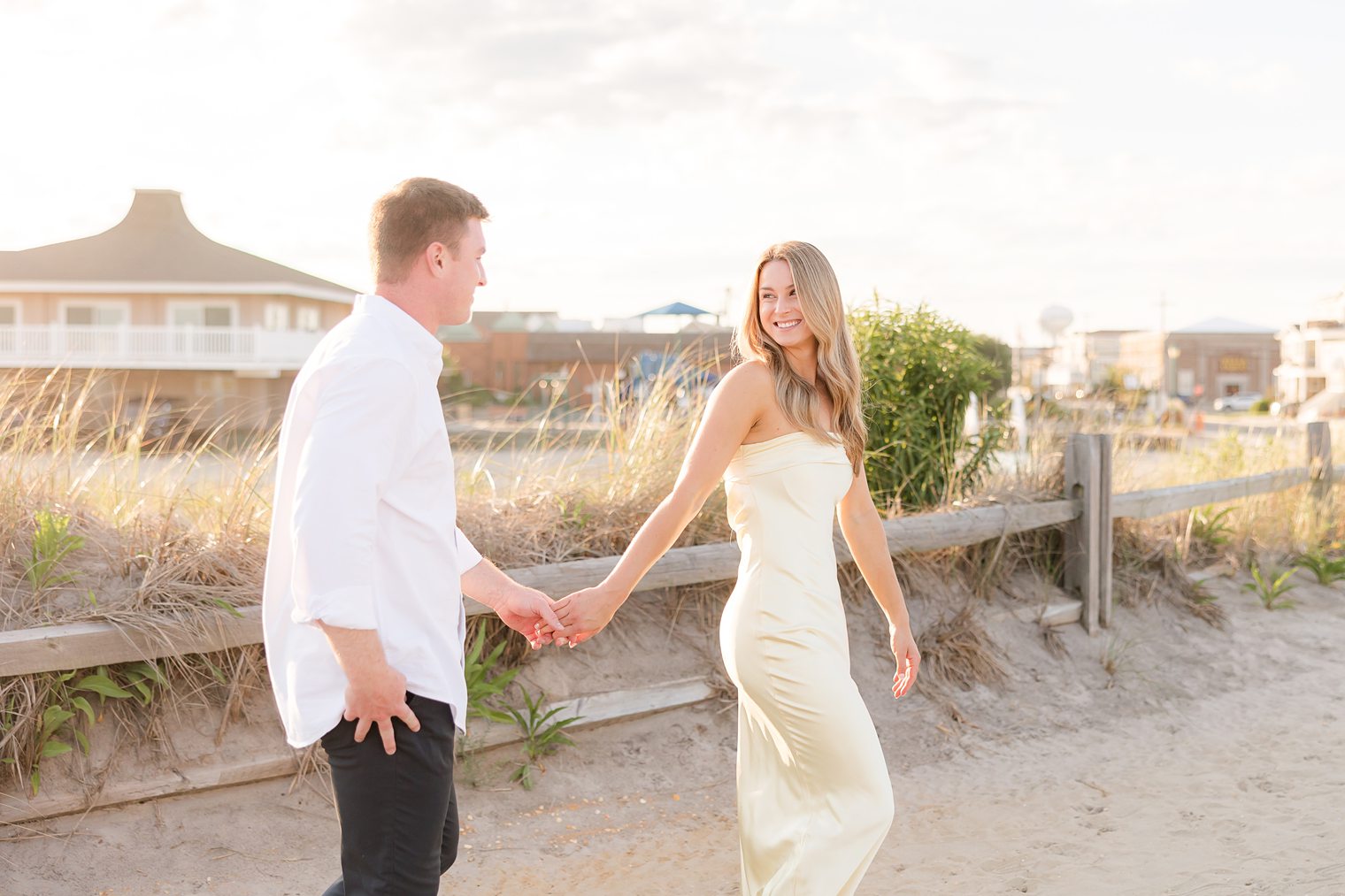 fiancé and bride looking each other while taking a walk