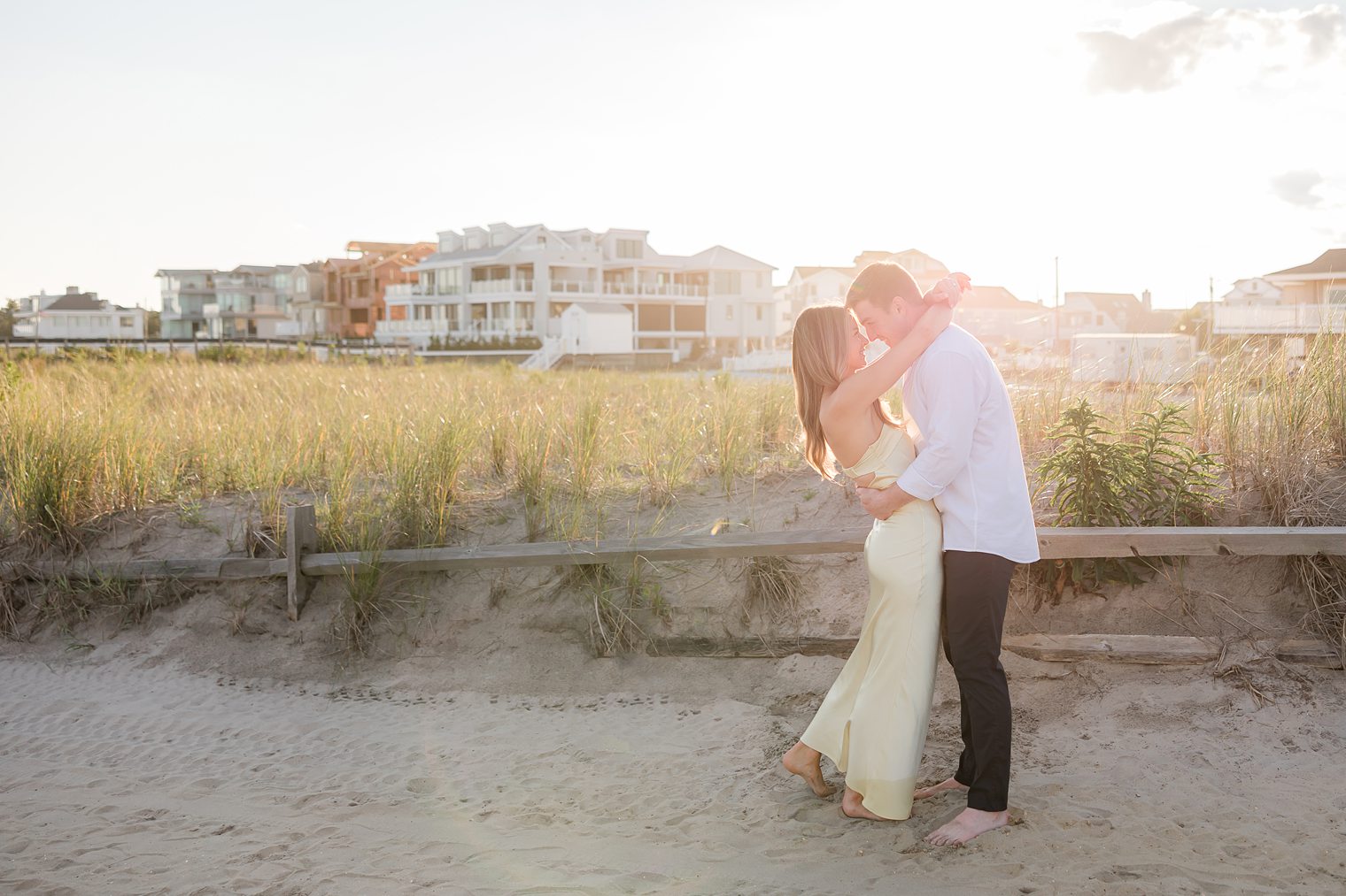 future husband and wife enjoying the sunset in their engagement session