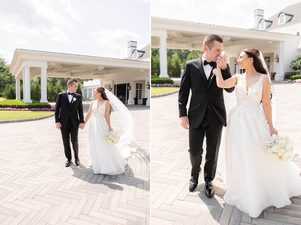 The couple standing together, and the groom is kissing the bride's hand at Shadowbrook
