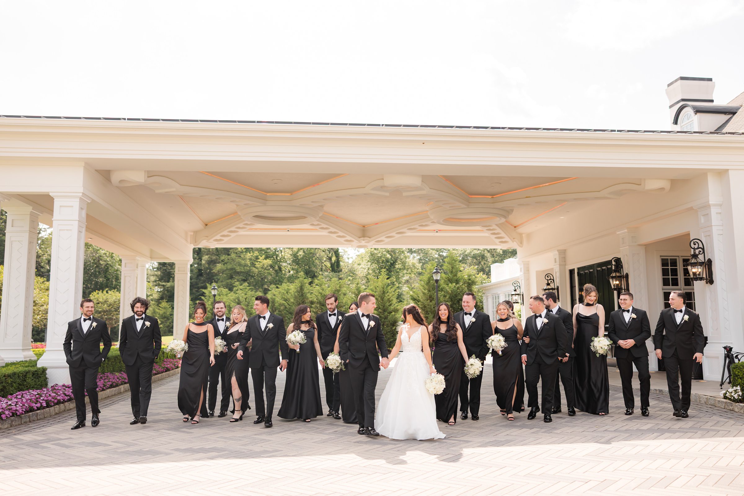 Picture of bride and groom together with bridesmaids and groomsmen