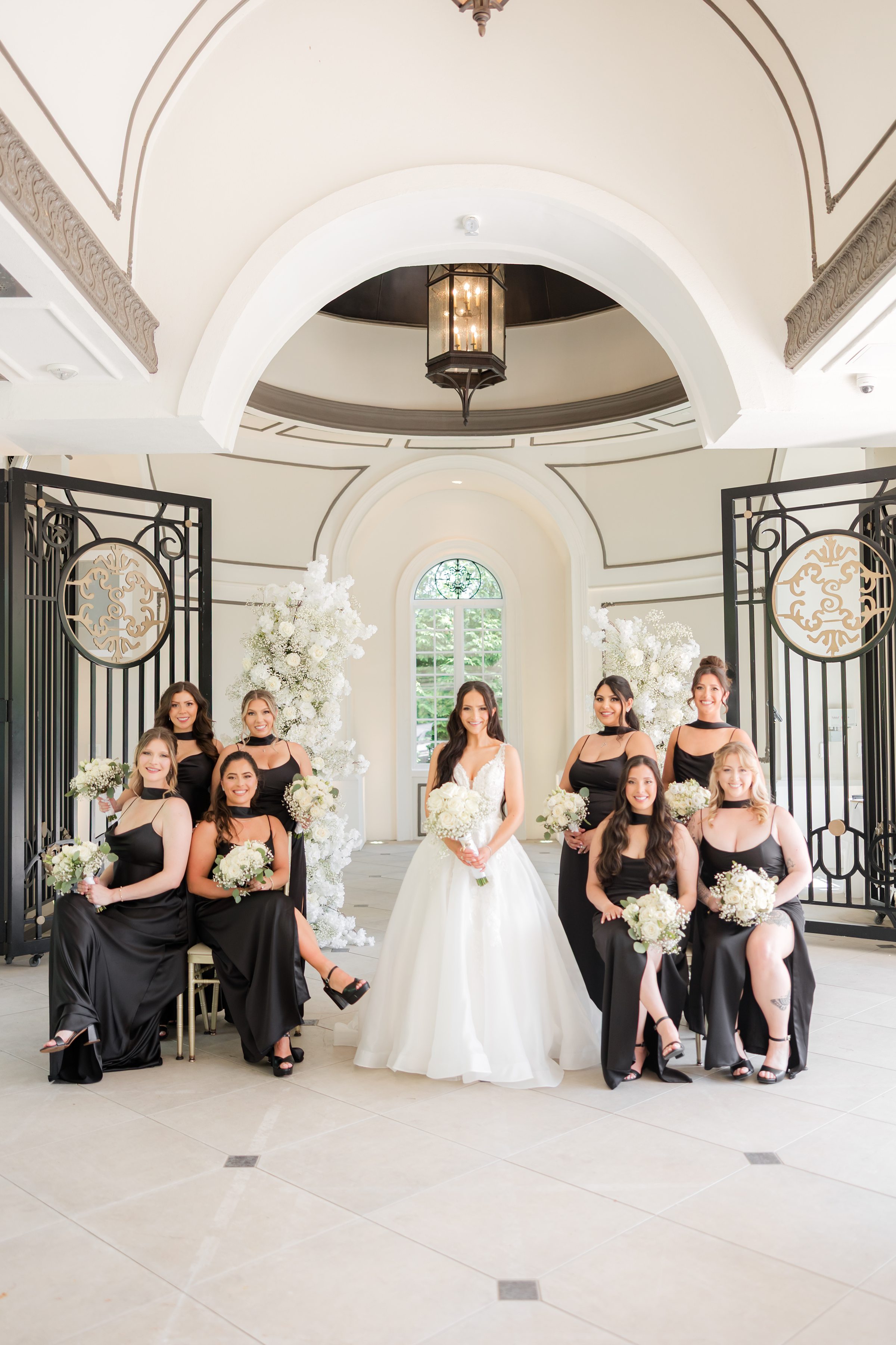 Bride with bridesmaids by the altar