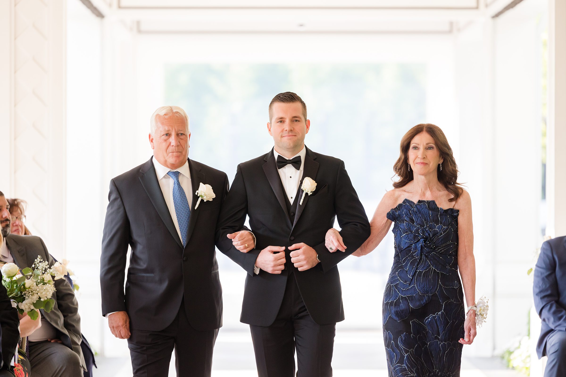 Parents of groom, walking him down the aisle 