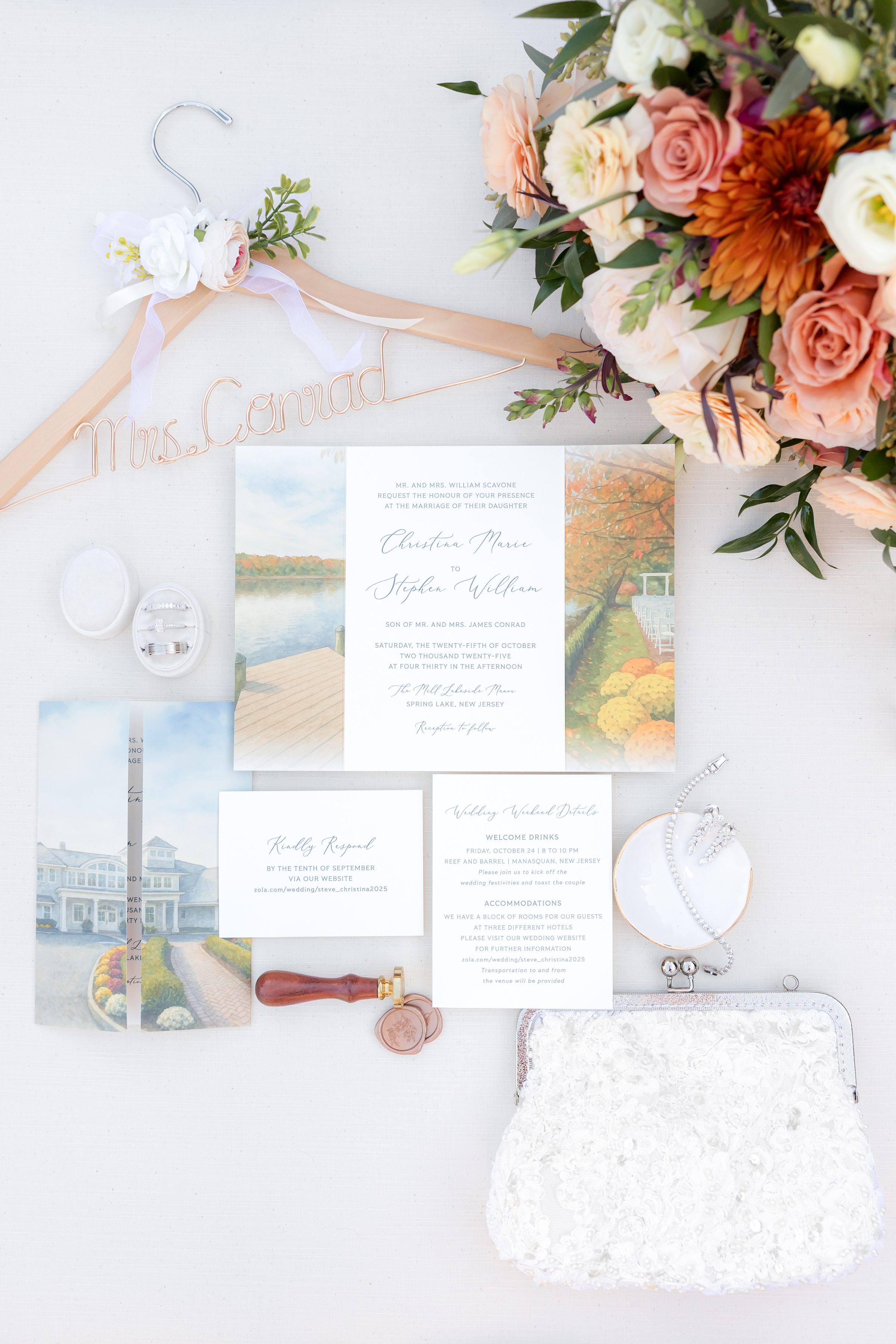 Wedding invitation suite, rings, jewelry, clutch, bouquet, ribbon, and wax seal arranged on a light background.