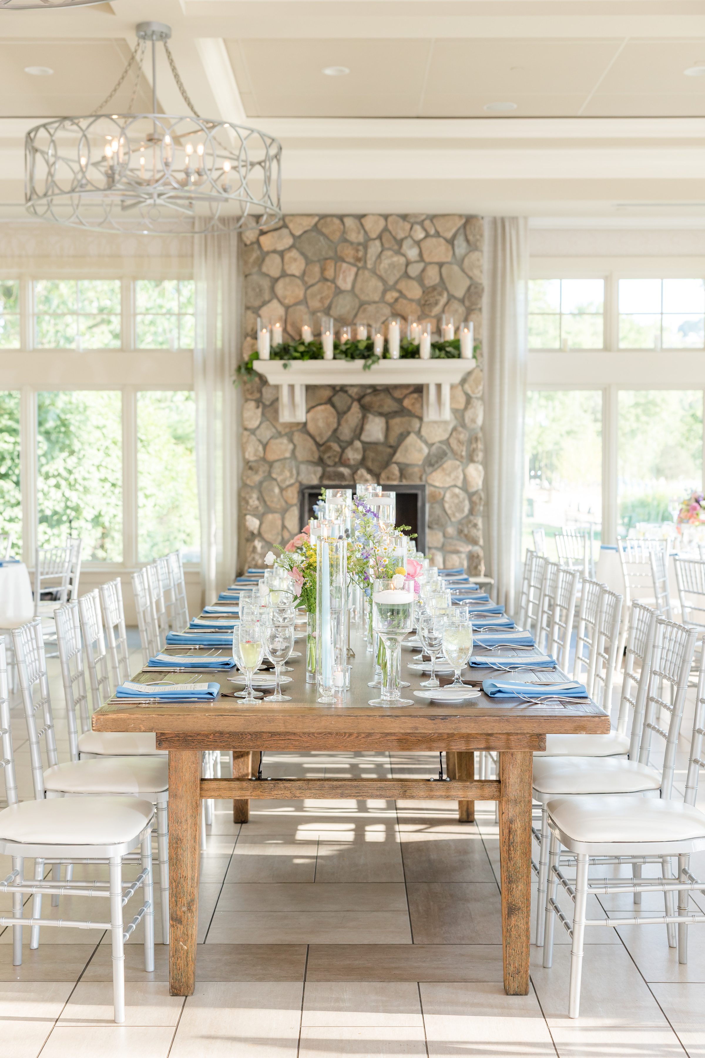 close up shot of long table with wooden, white and powder blue palette 