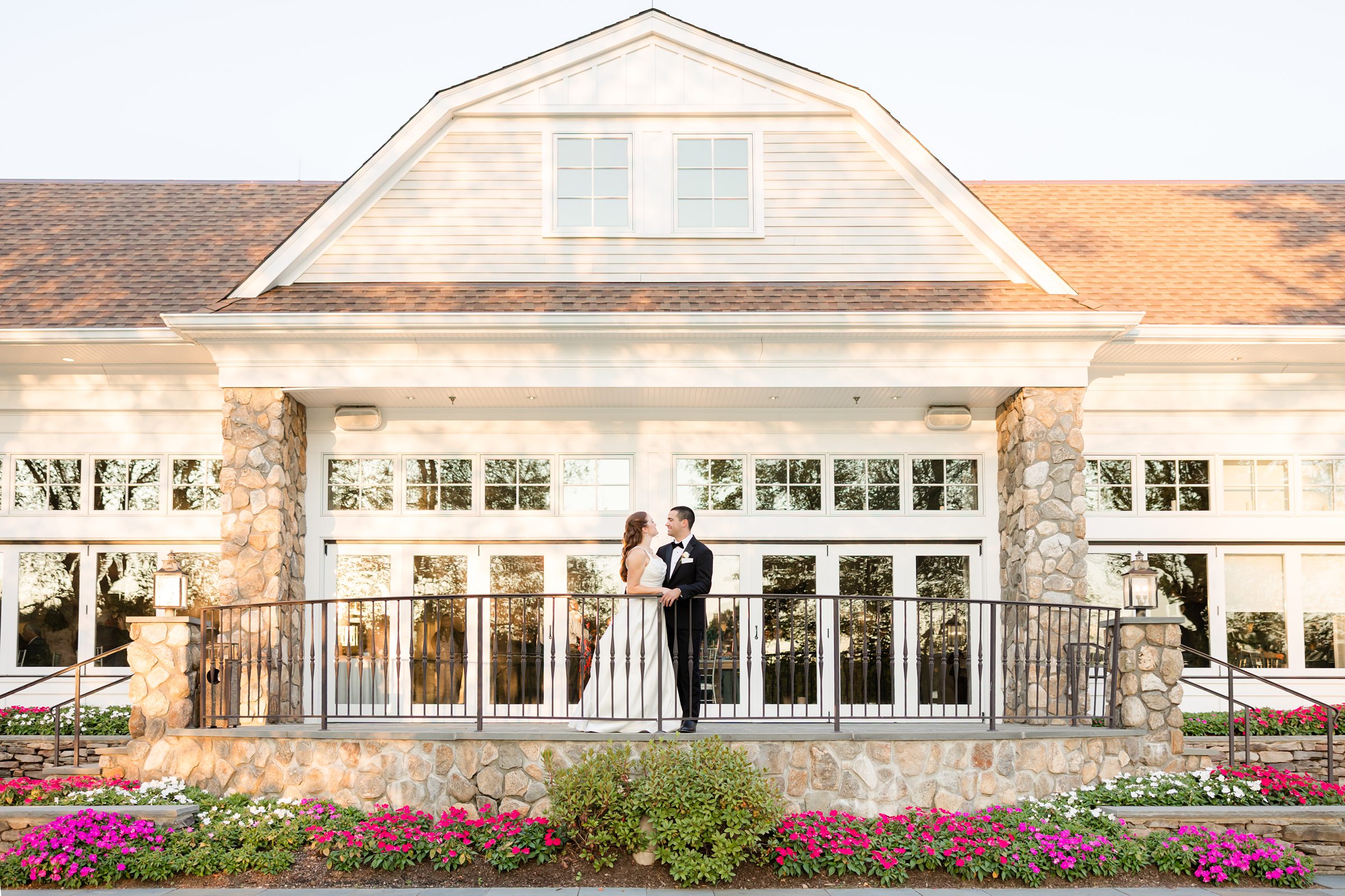 landscape photo of bride and groom, looking at each other at Indian Trail Club 