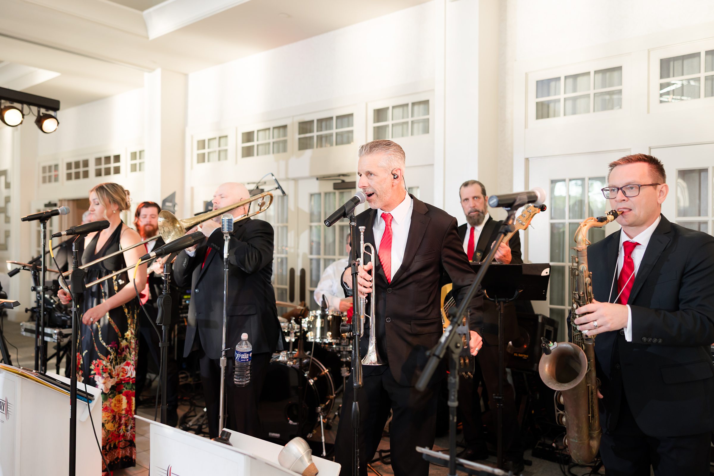 music band playing saxophone, electric guitar and drums