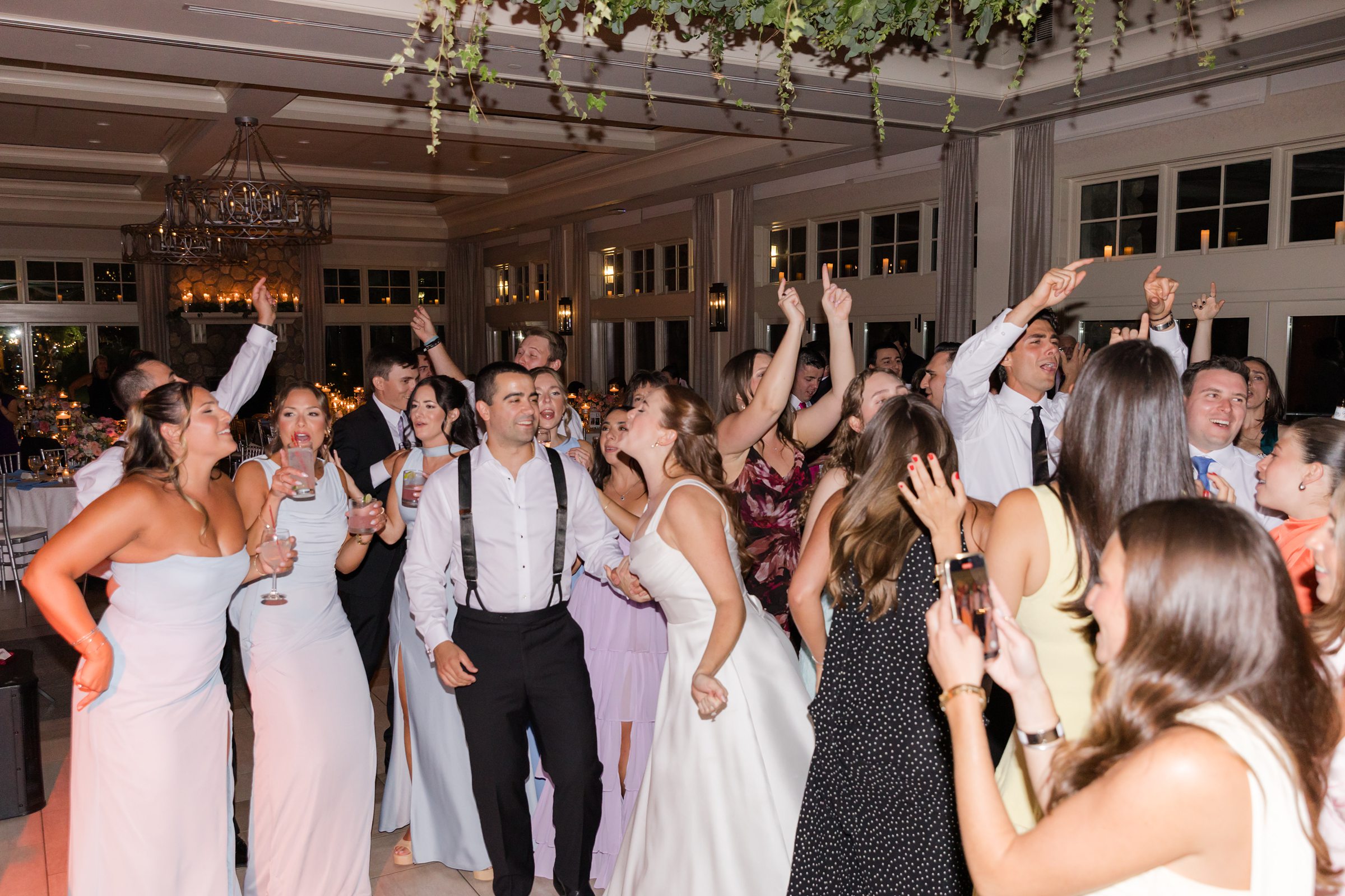 landscape photo of bride and groom dancing after party