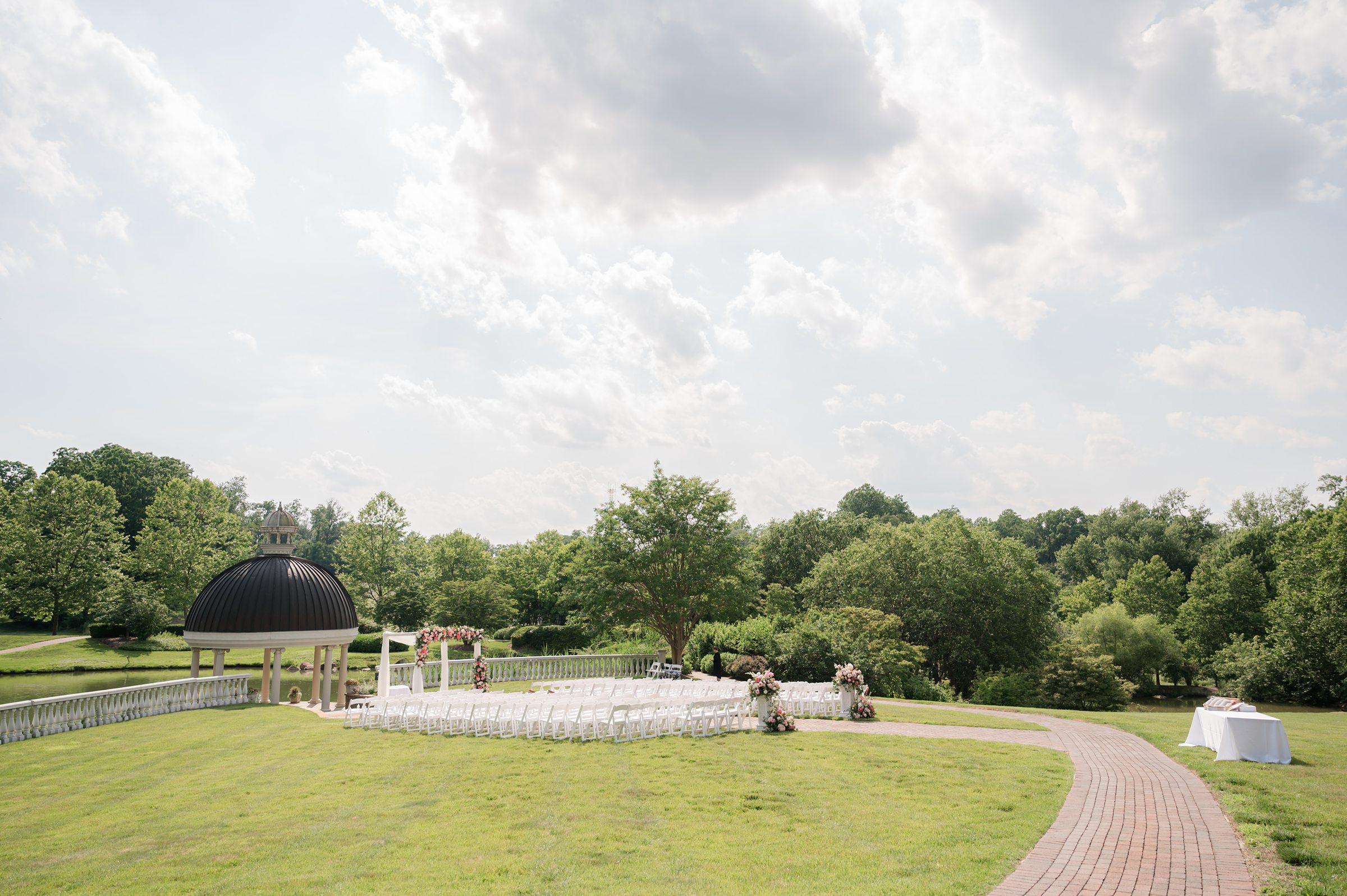 Photo of the ceremony at the garden, facing the gazebo