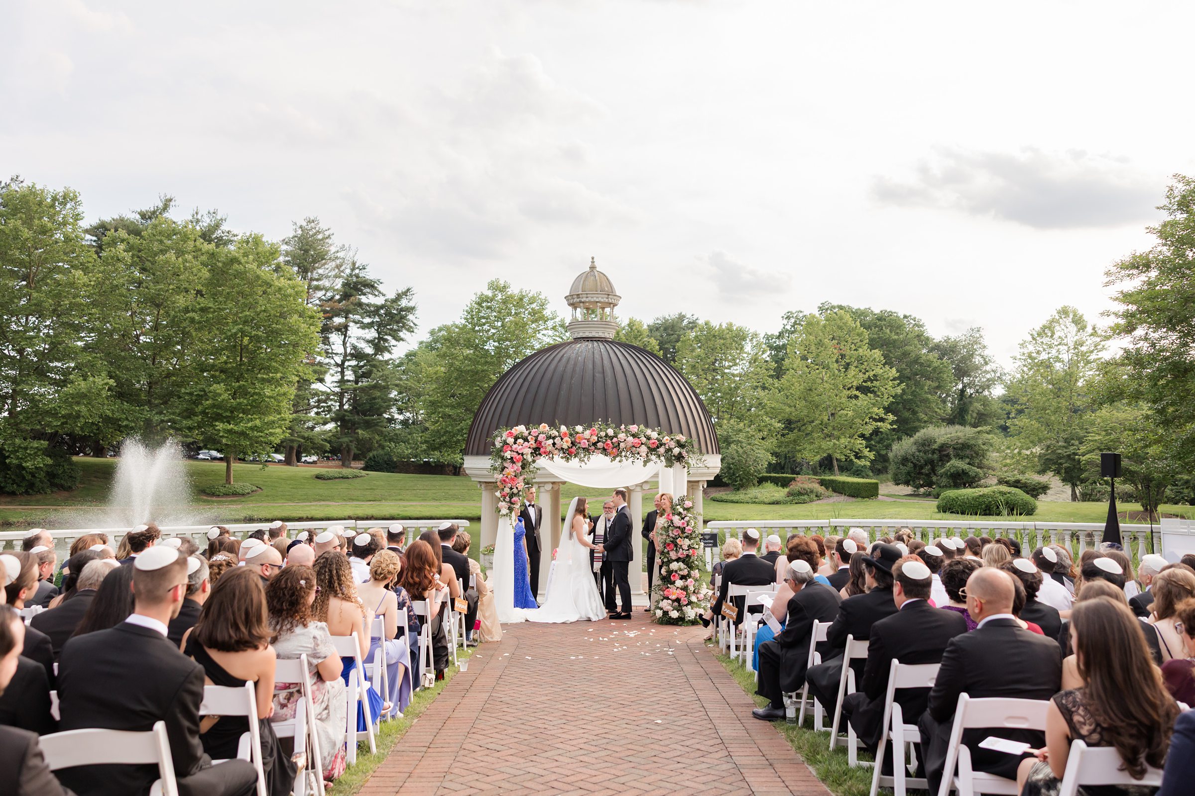 Bride and groom standing in front of each other during the ceremony