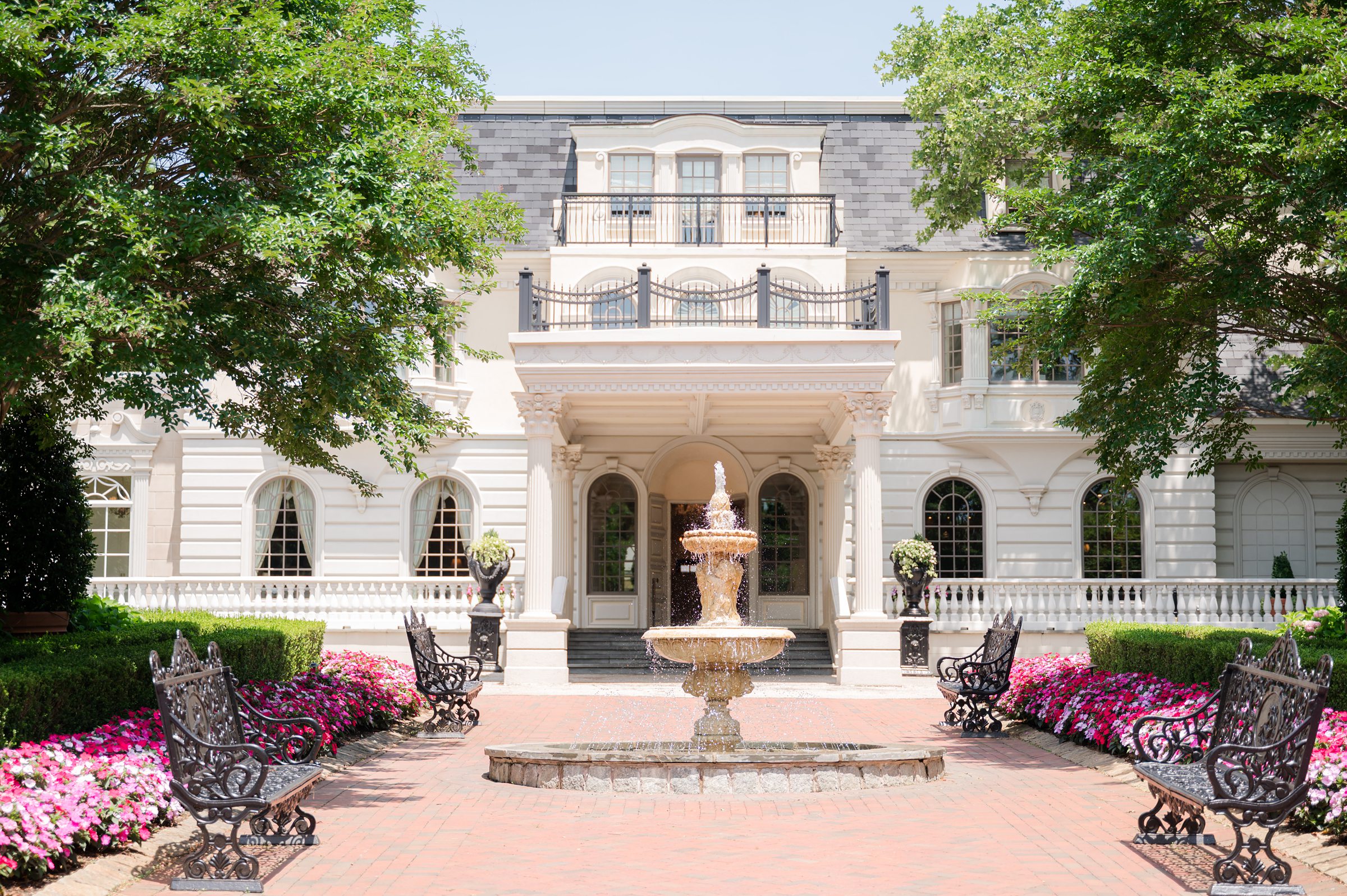 A nice sunny day, a facade of Ashford Estate with a mini fountain. 