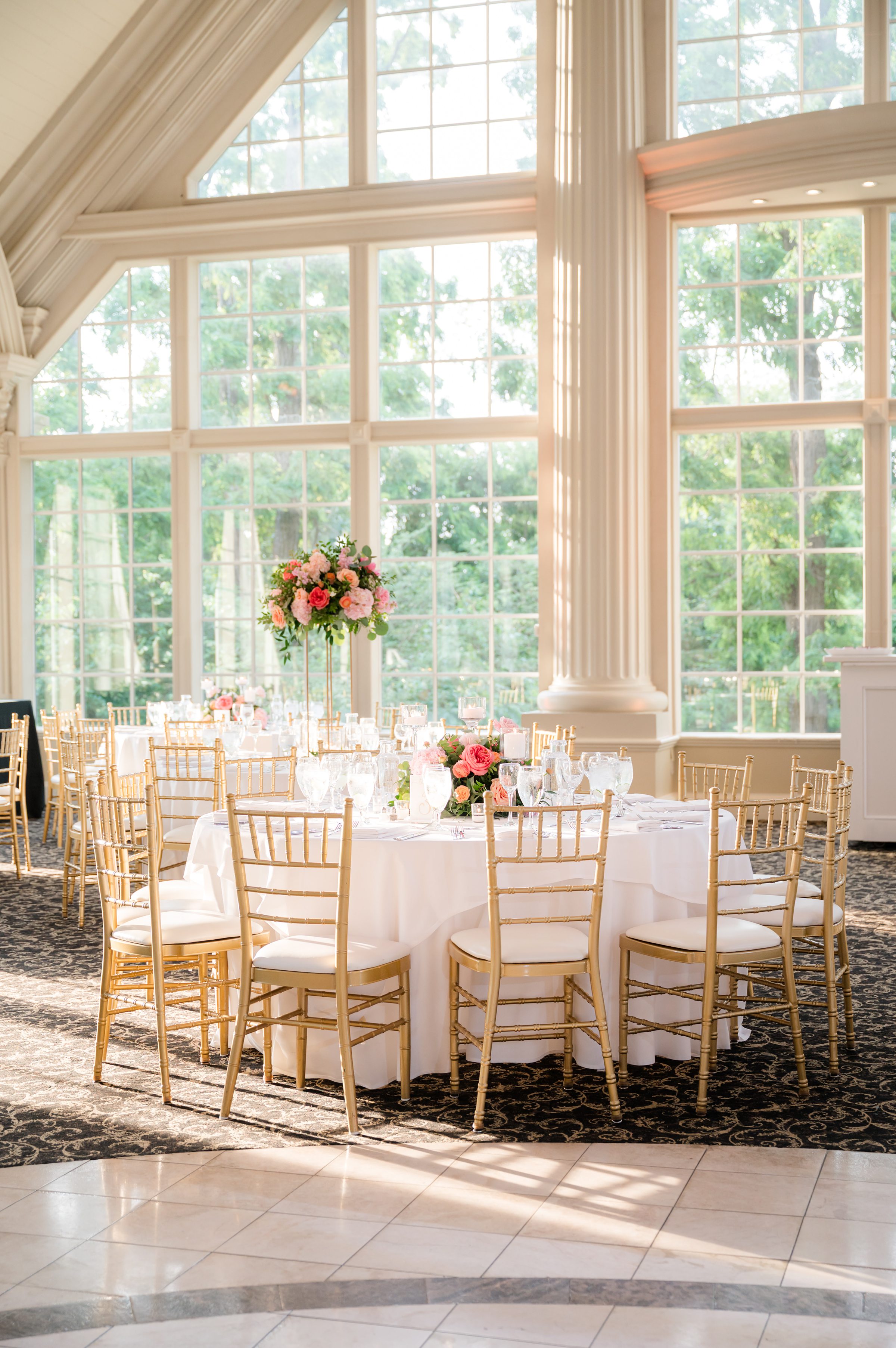 Close-up picture of decorated table, white table cloth, golden chairs