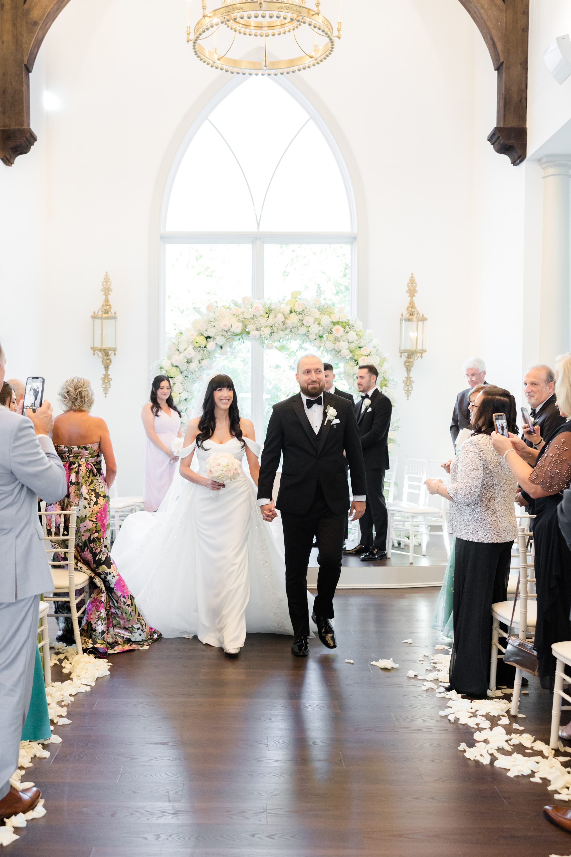 bride and groom walking down the aisle after ceremony