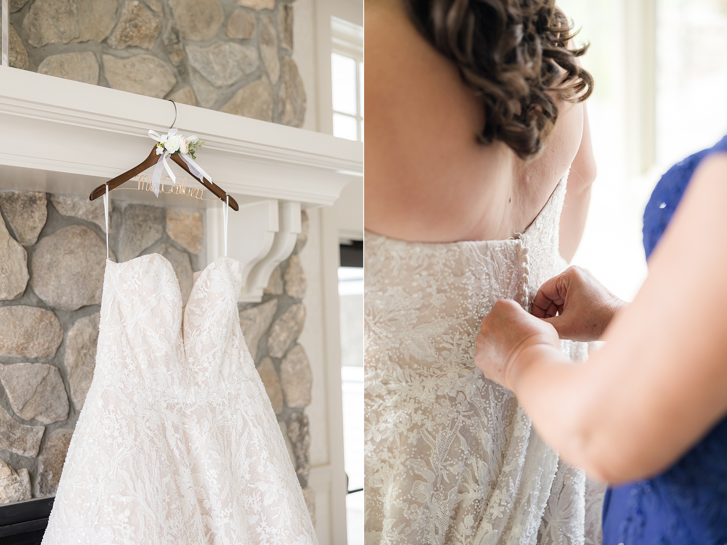 Wedding dress hanging on a personalized hanger and a loved one helping button the back of the bride’s gown