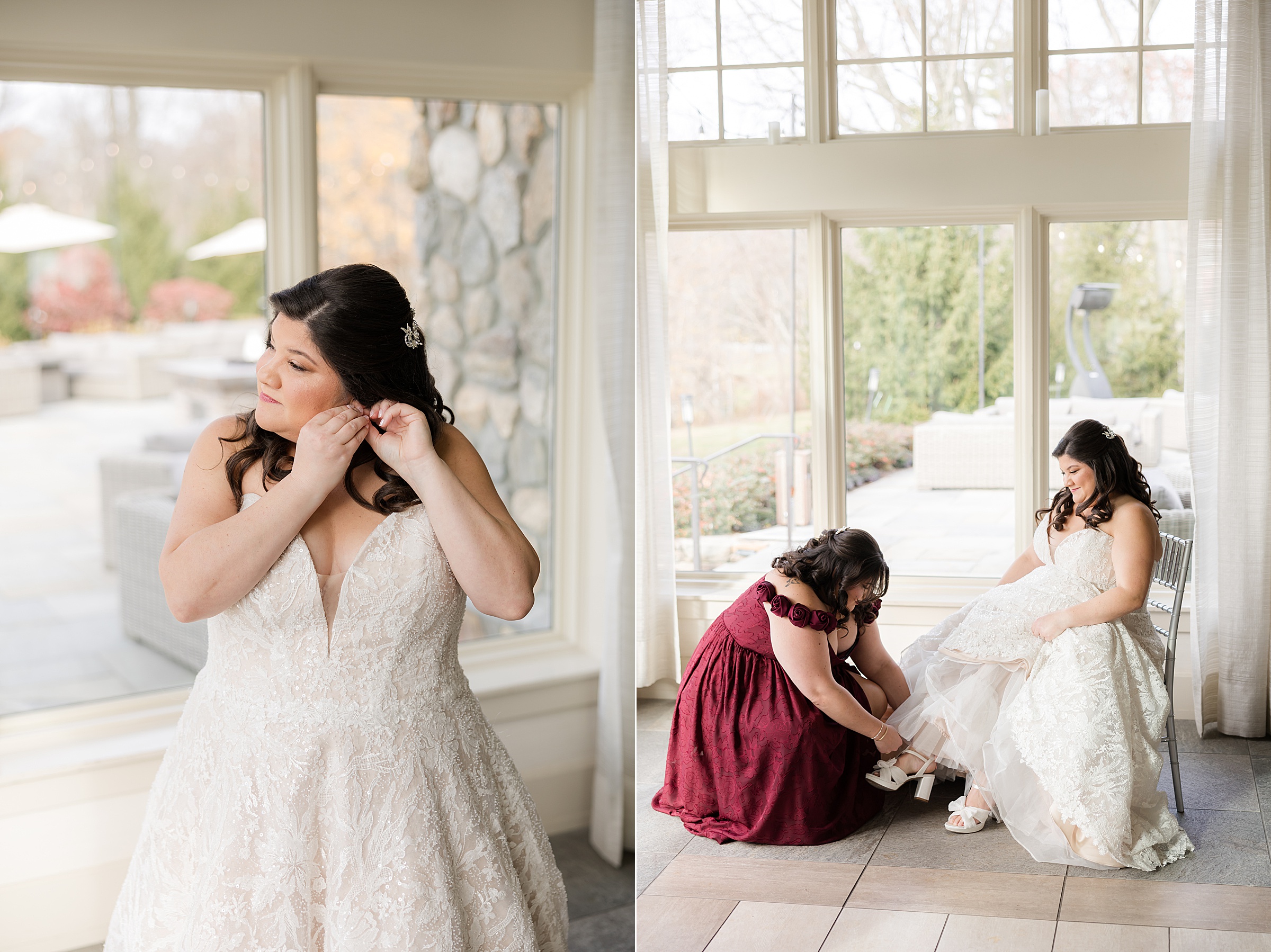 Bride putting on earrings and her sister helping adjust her shoe in a bright, window lit room