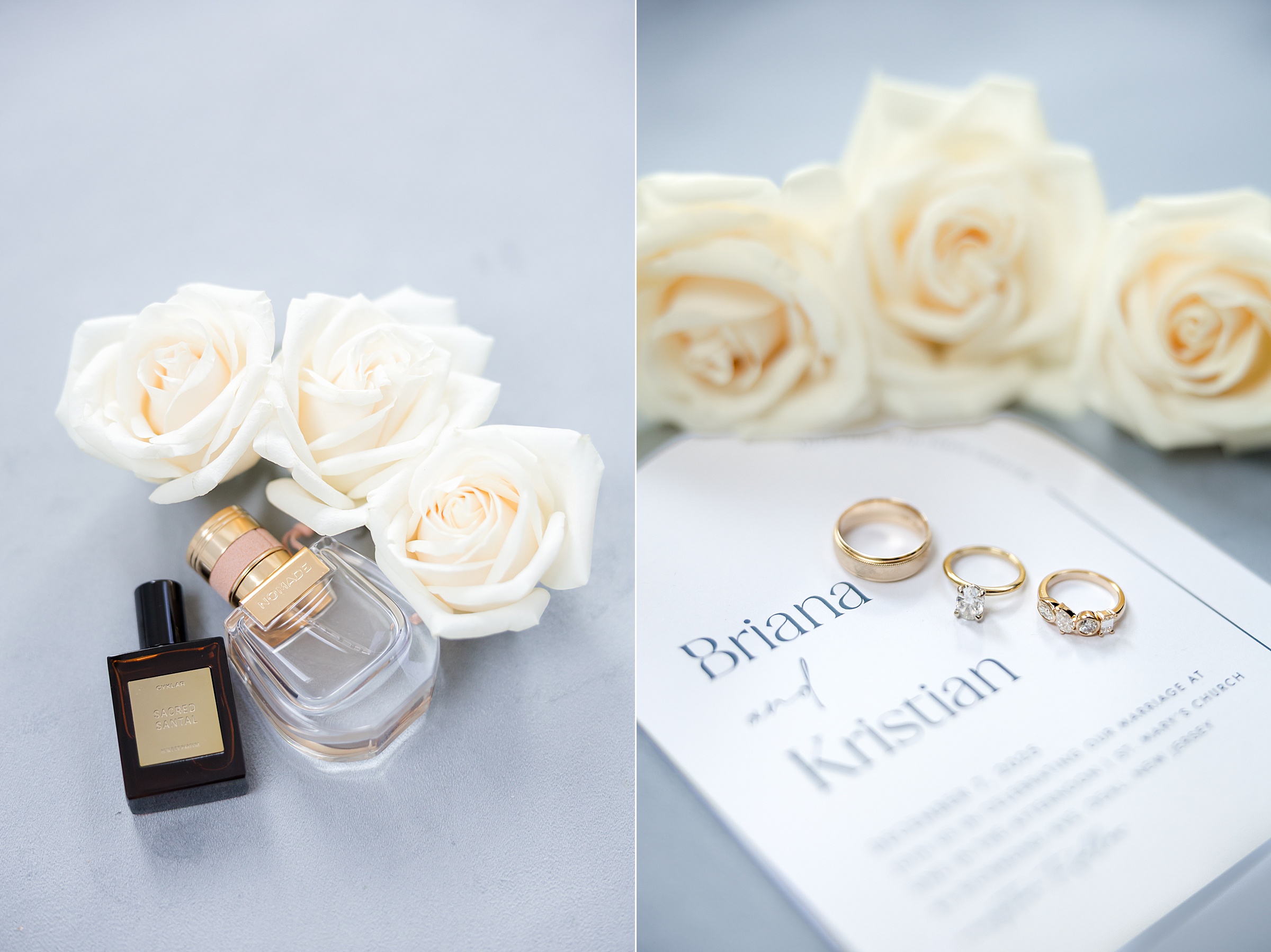 White roses and perfume bottles alongside a wedding invitation with gold rings arranged on top.