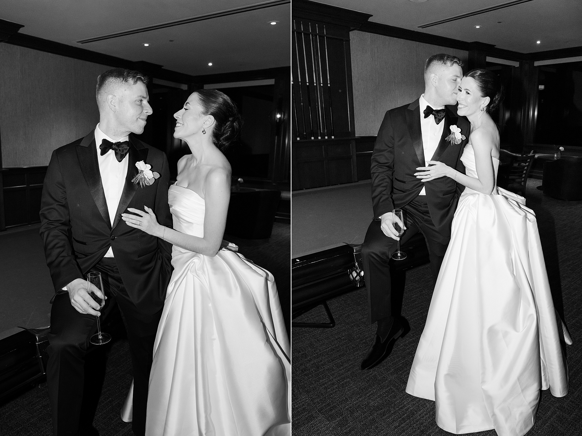 Bride and groom in a lounge, smiling and sharing a playful, affectionate moment while holding drinks.